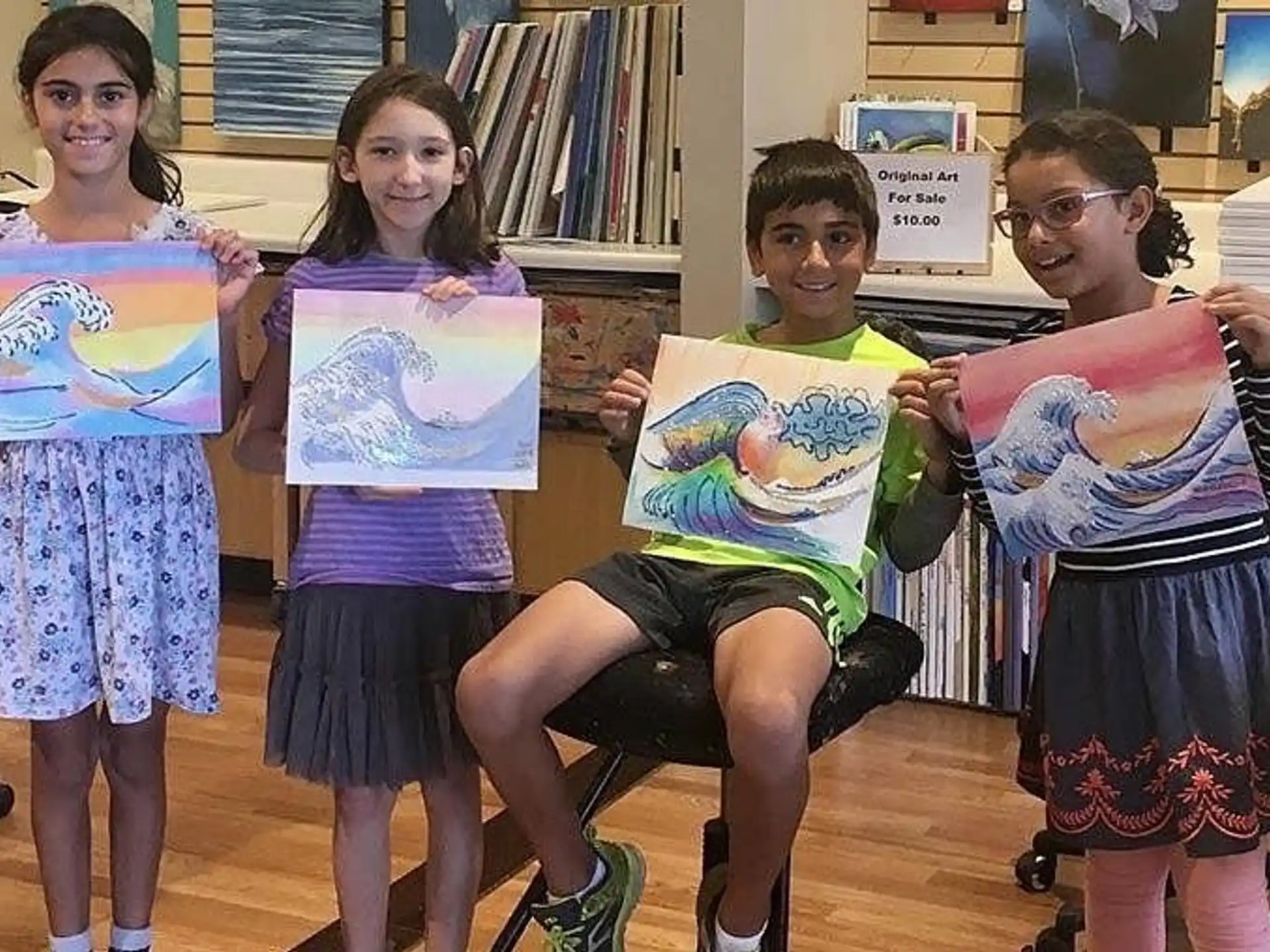 a group of children holding up posters
