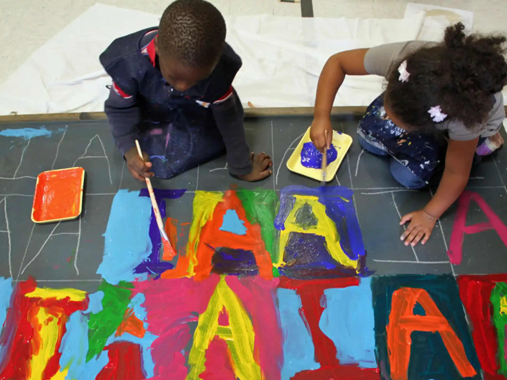 a couple of kids painting