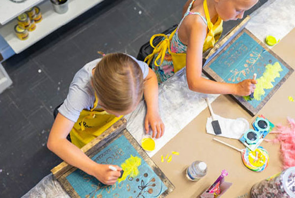 a child painting on a table