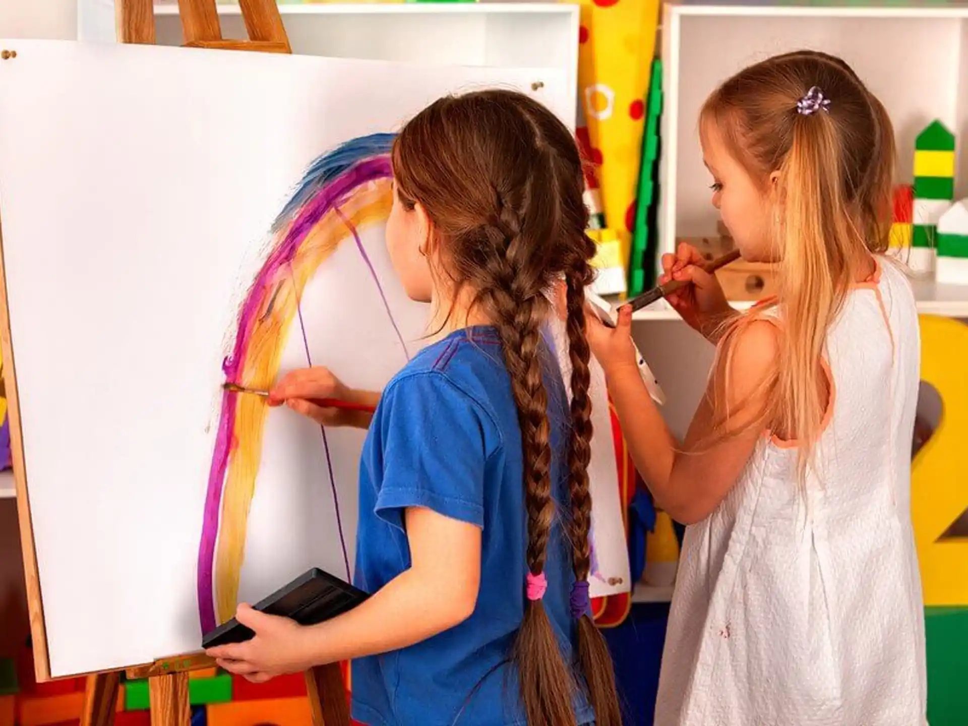 a few young girls painting