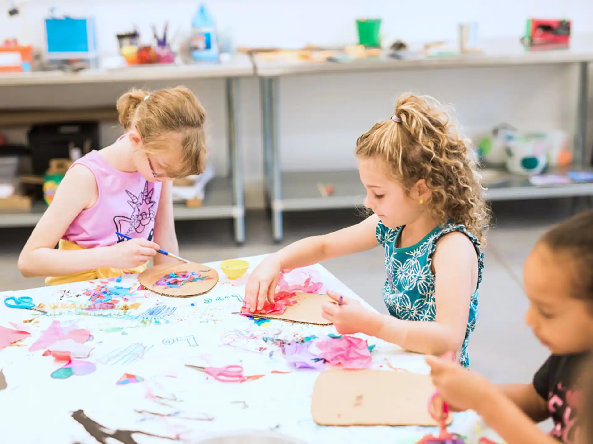 a group of children painting