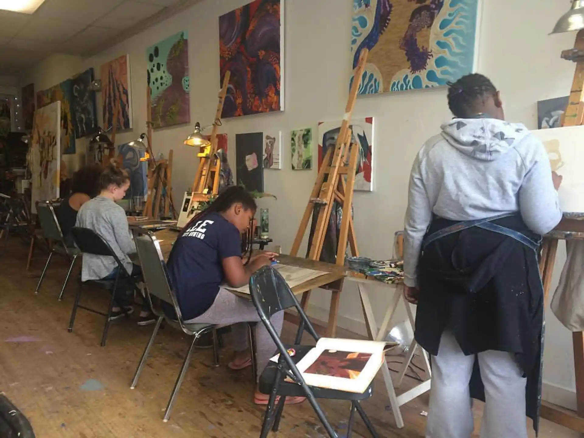 a group of people painting