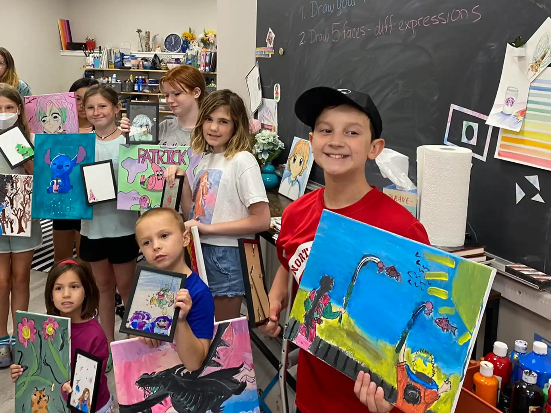 a group of children holding up posters