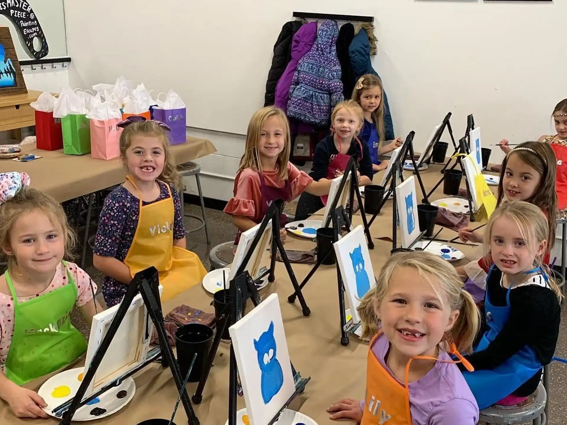 a group of children sitting at a table