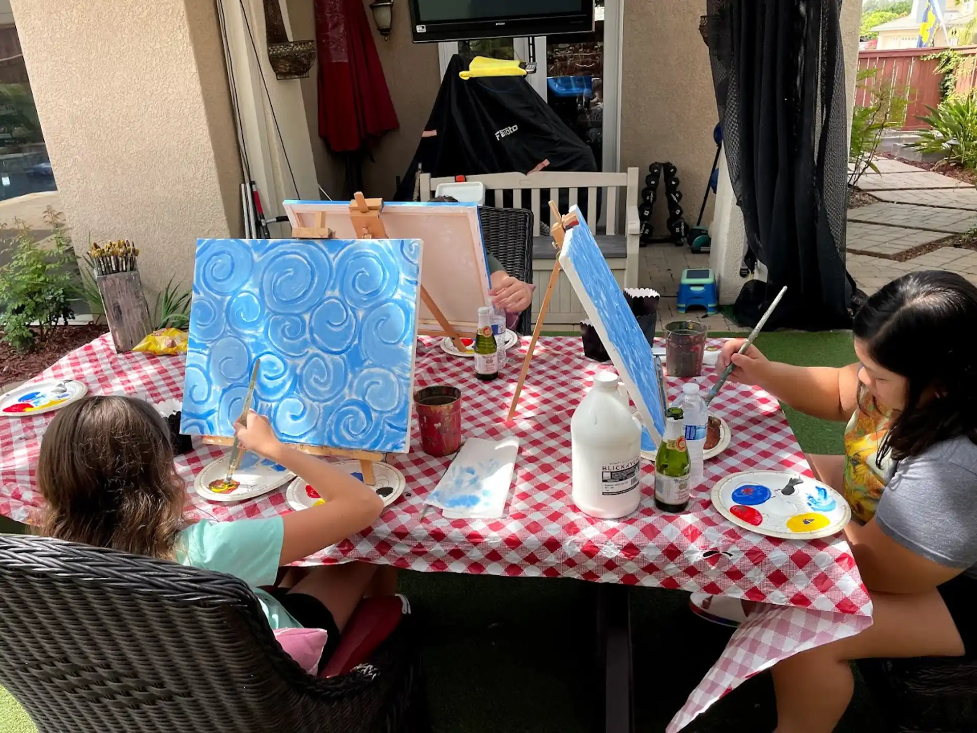 a group of people sitting around a table eating food