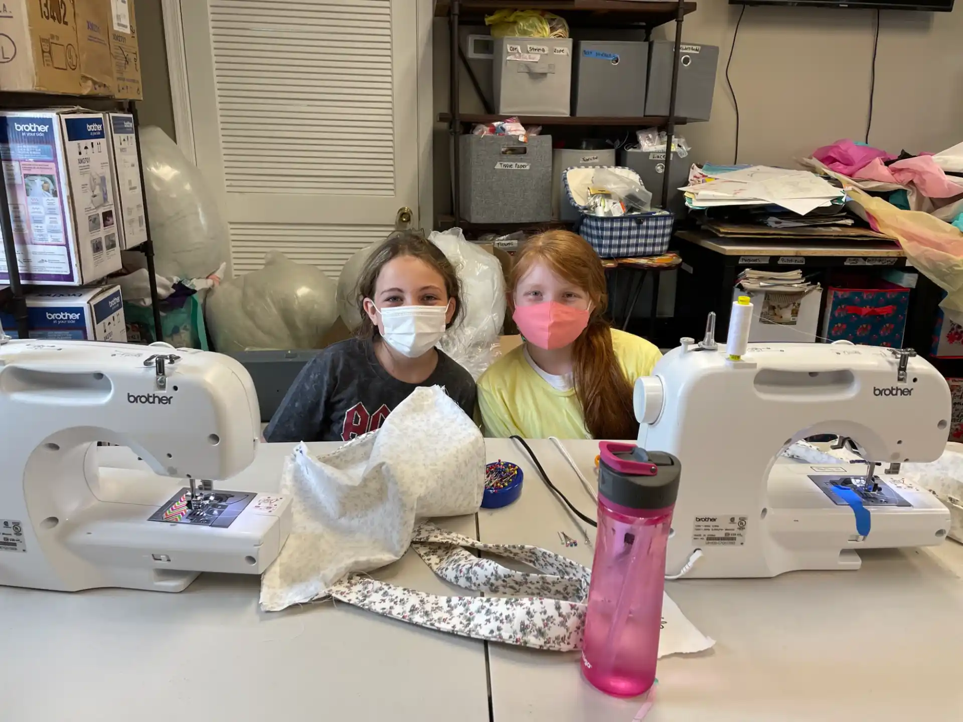 a couple of girls in a lab