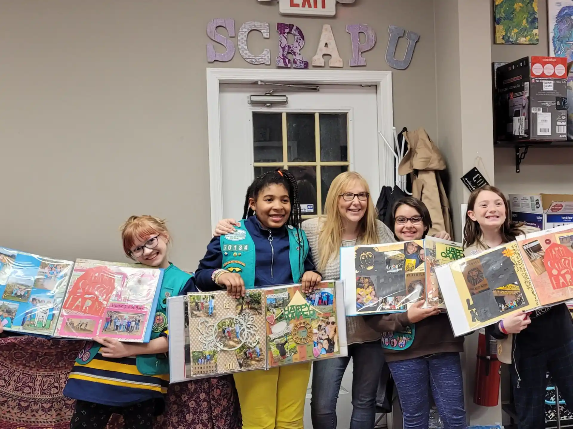 a group of people holding books