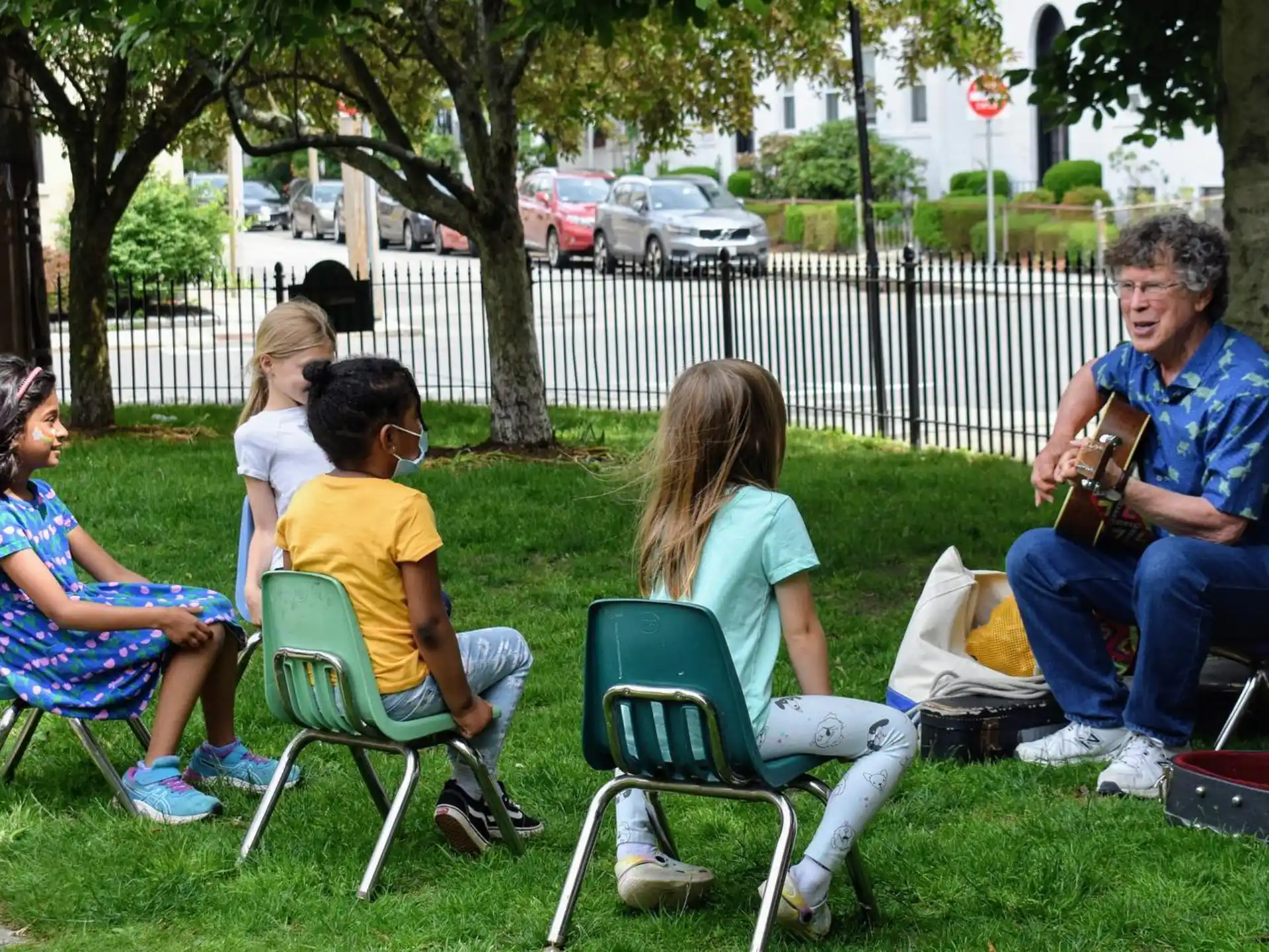 a group of people sitting in lawn chairs