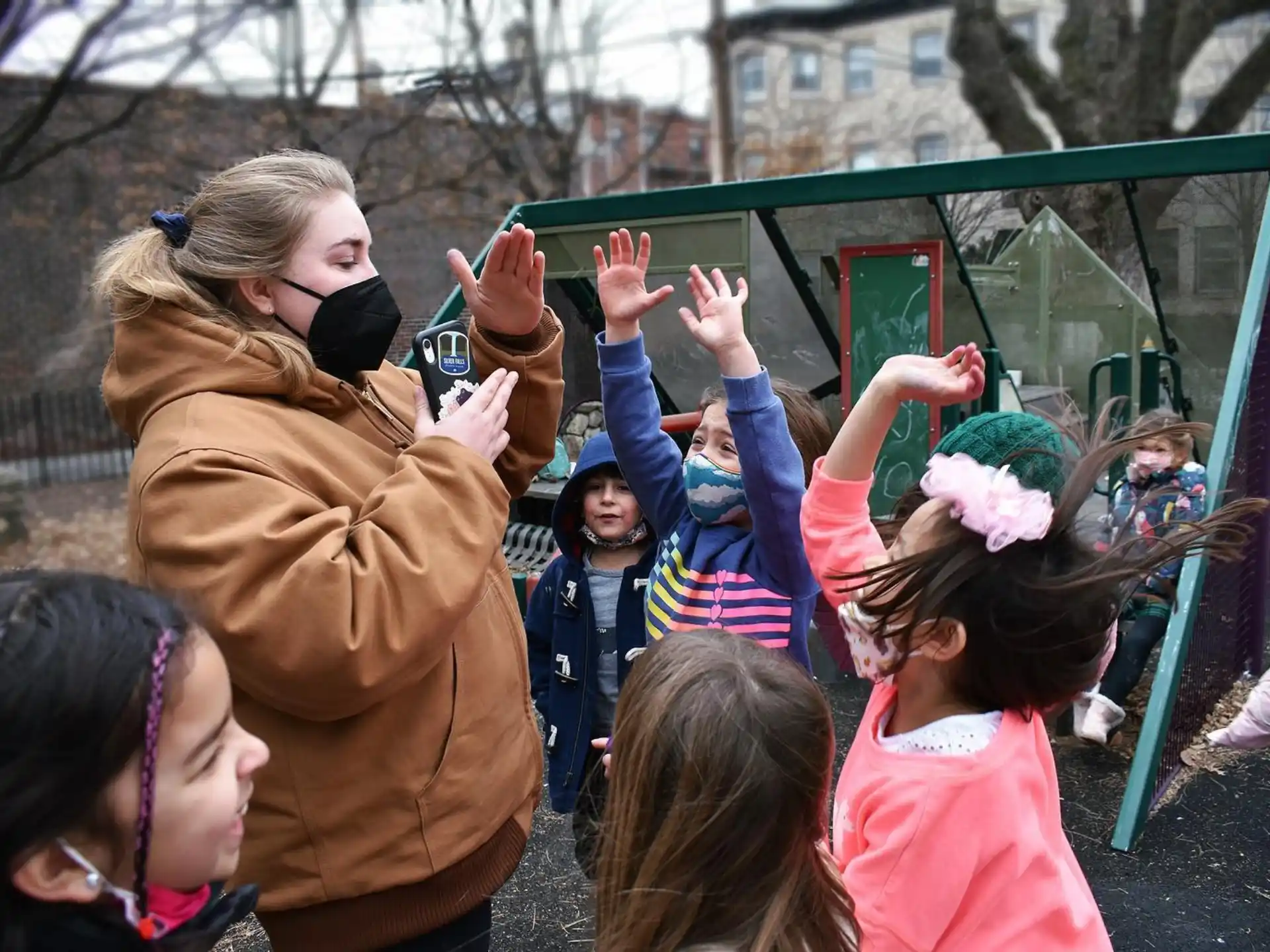 a group of people with their hands up