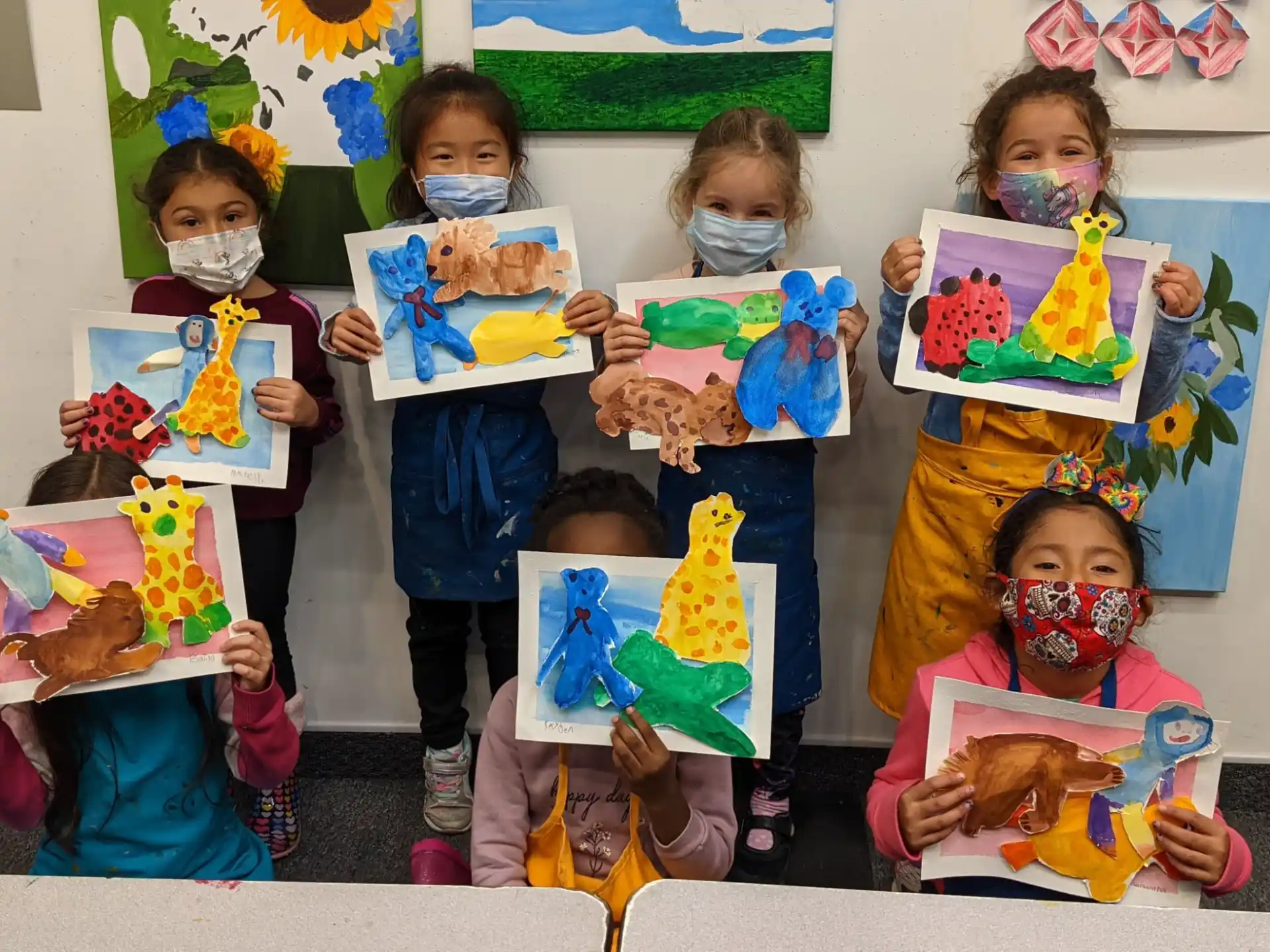 a group of children holding books