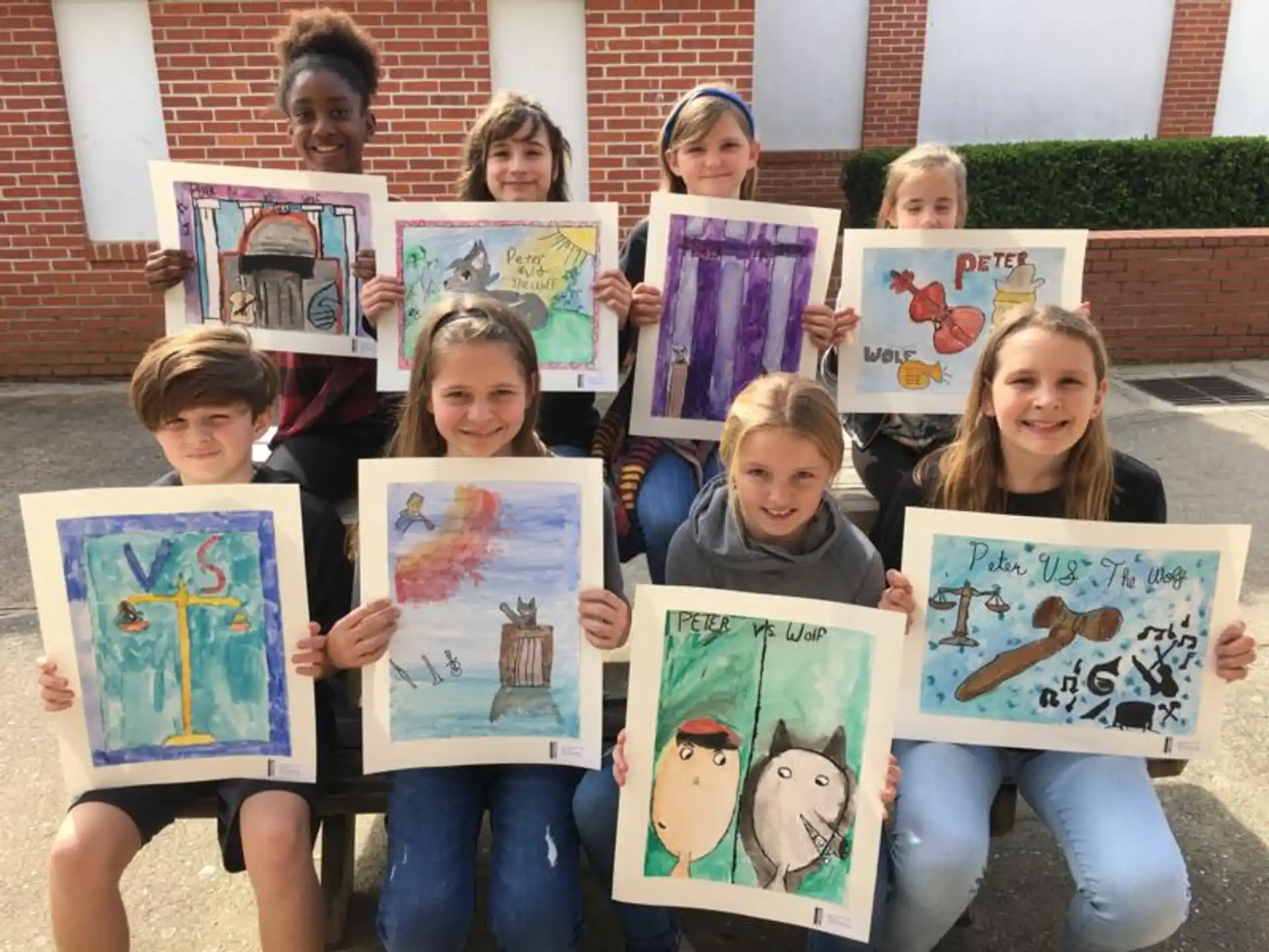a group of children holding books