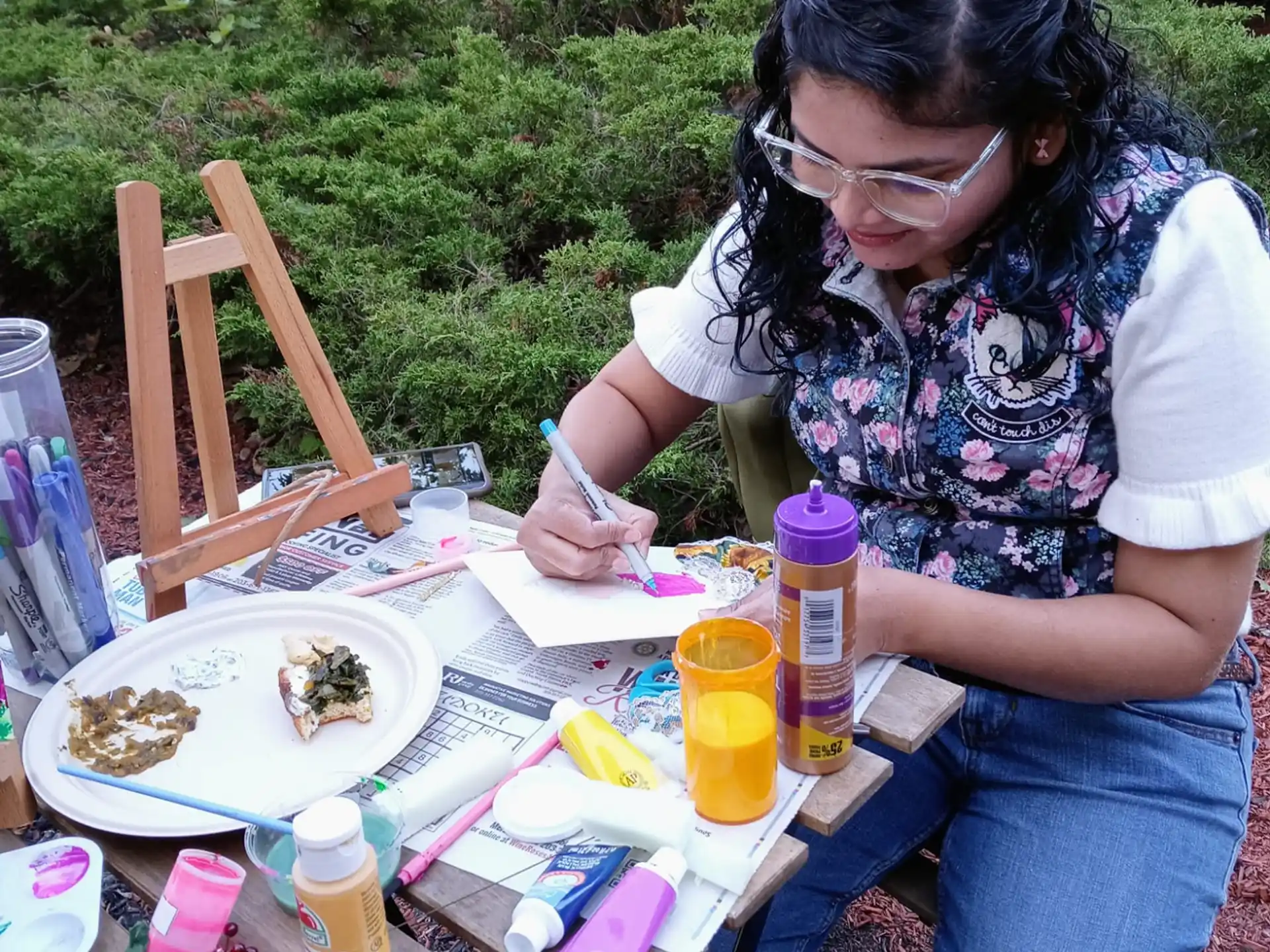 a woman sitting at a table eating