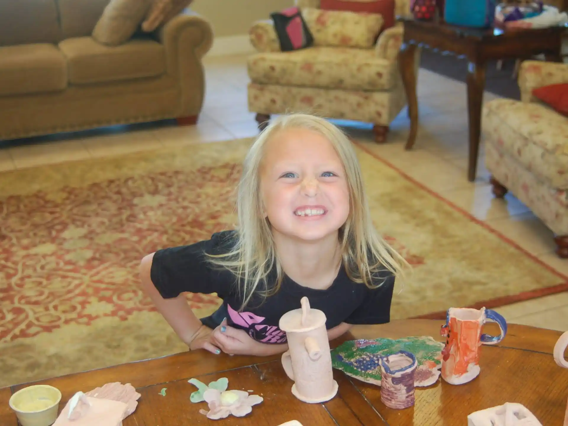 a girl sitting at a table