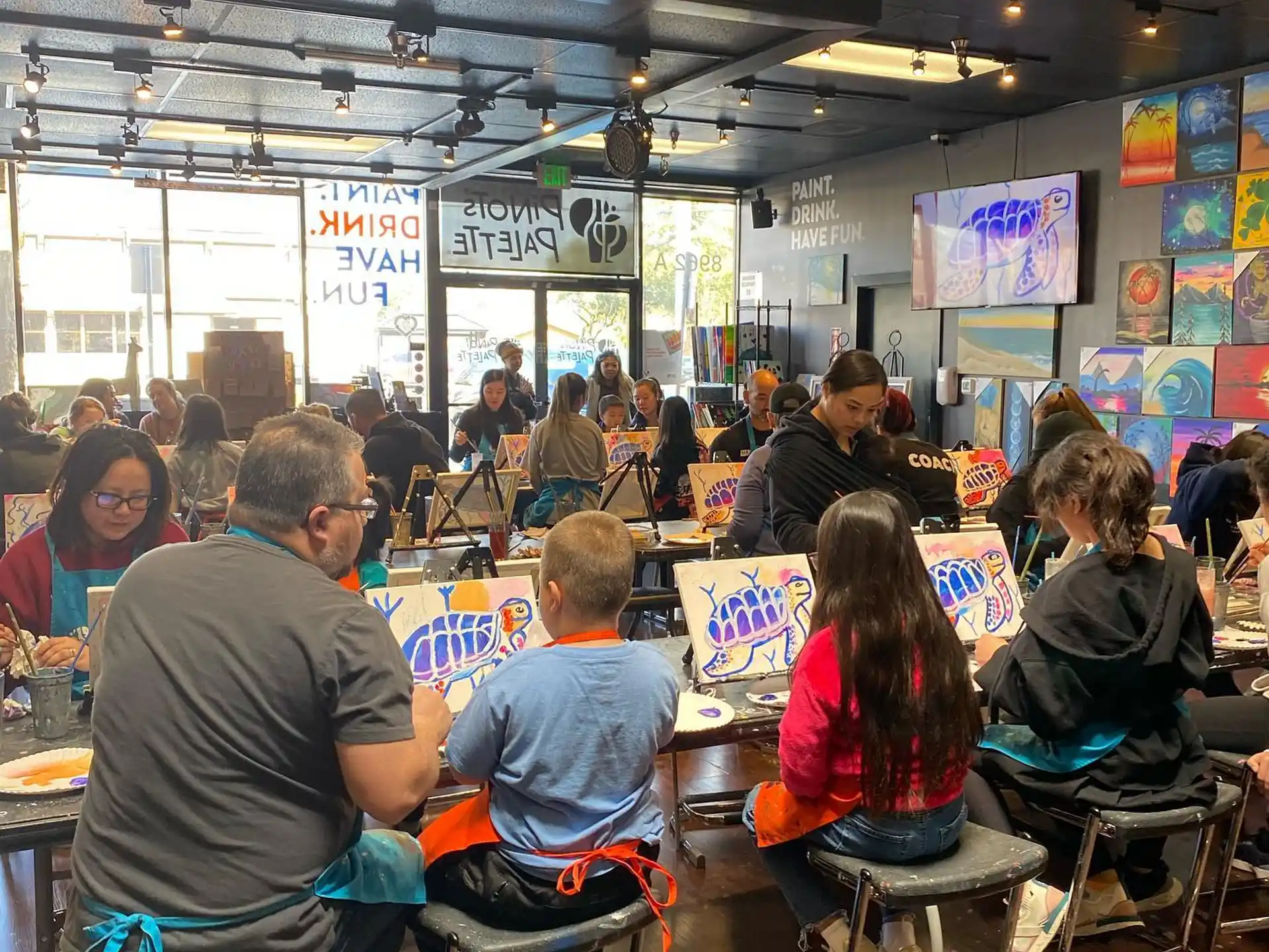 a group of people sitting at tables