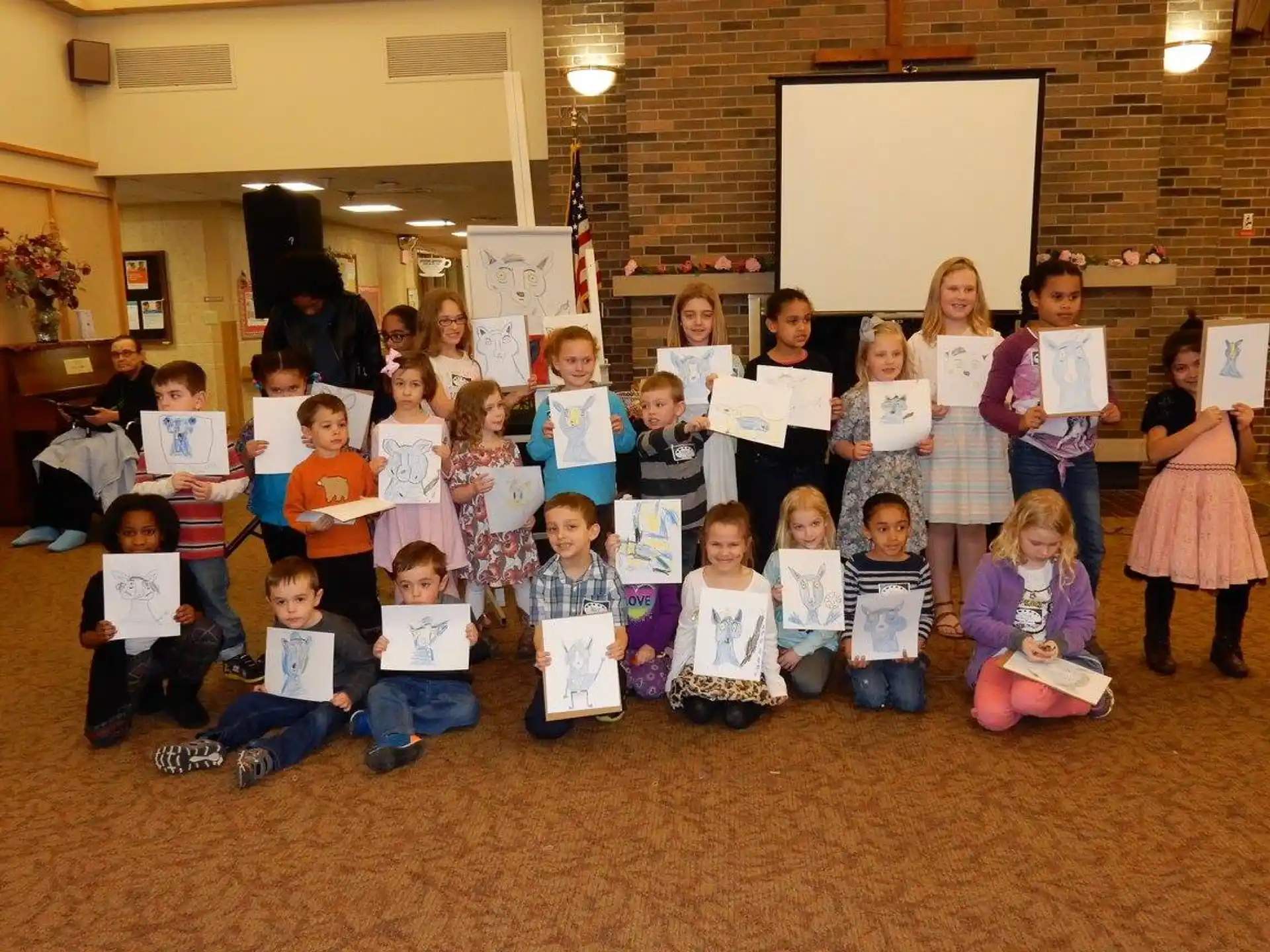 a group of children holding papers