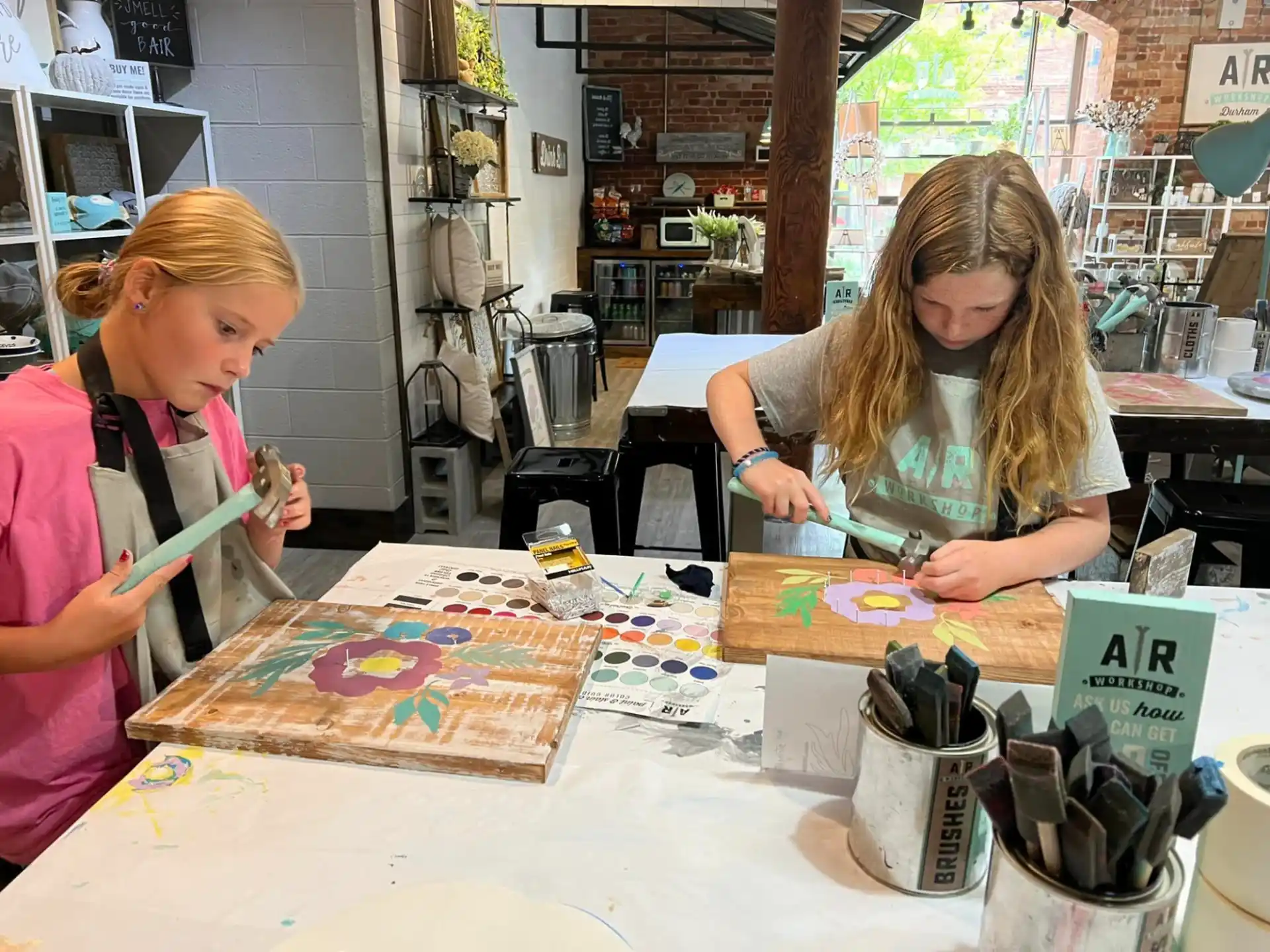 a couple of women painting