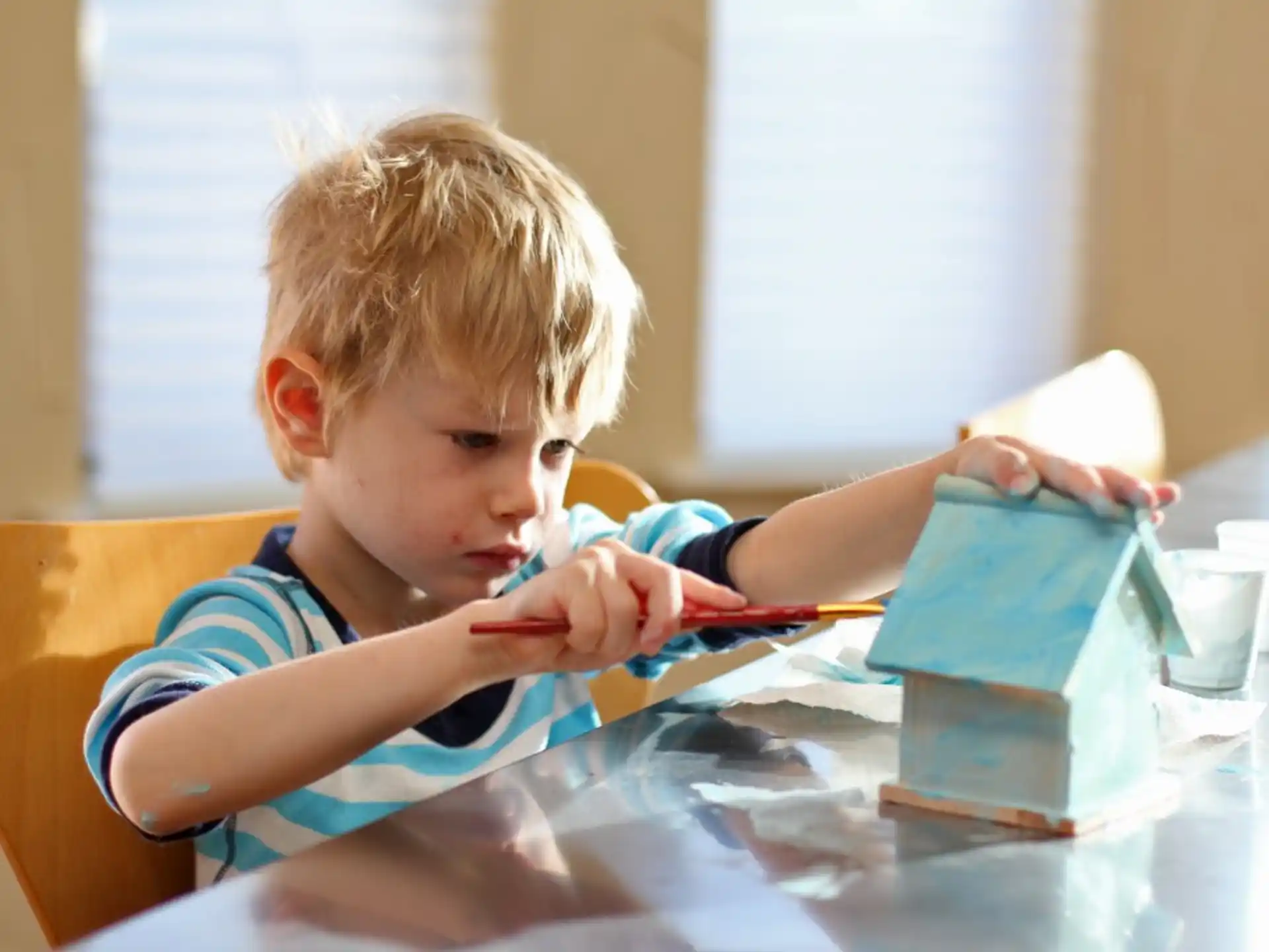 a young boy brushing his teeth