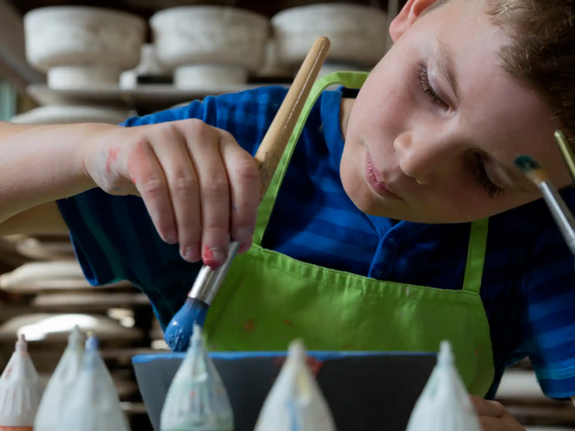 a young boy painting