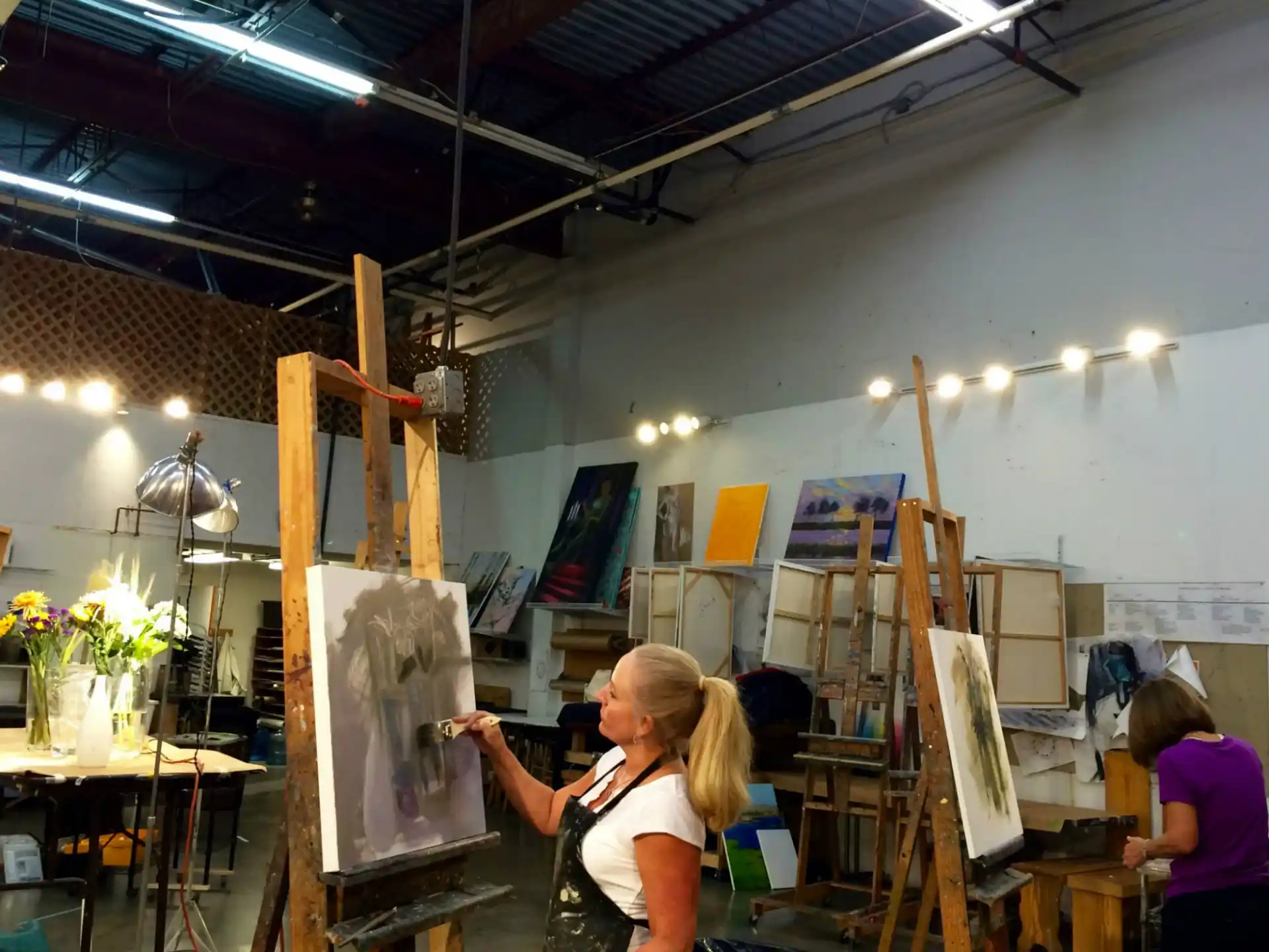 a person painting in a room