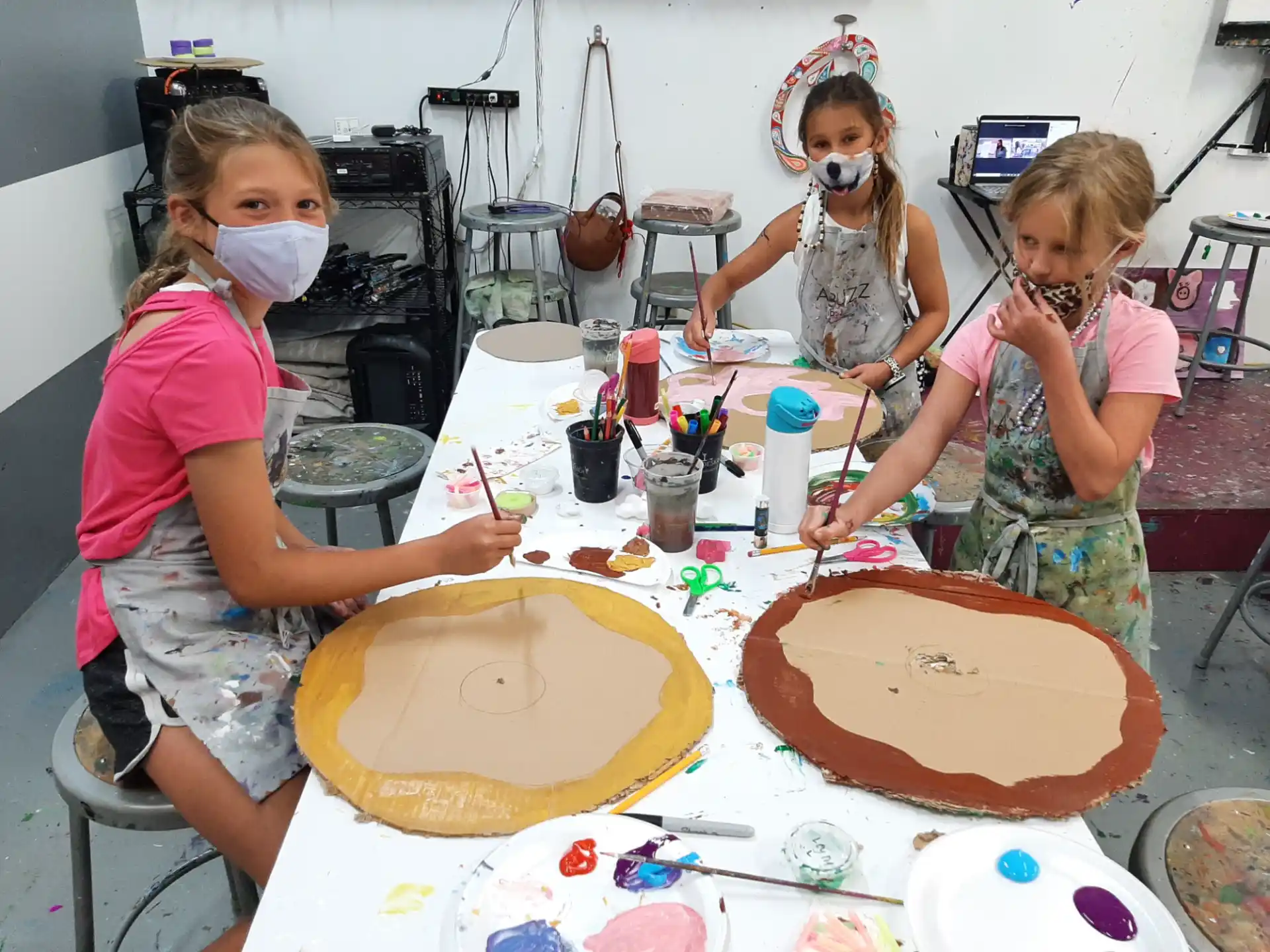 a group of kids making a cake
