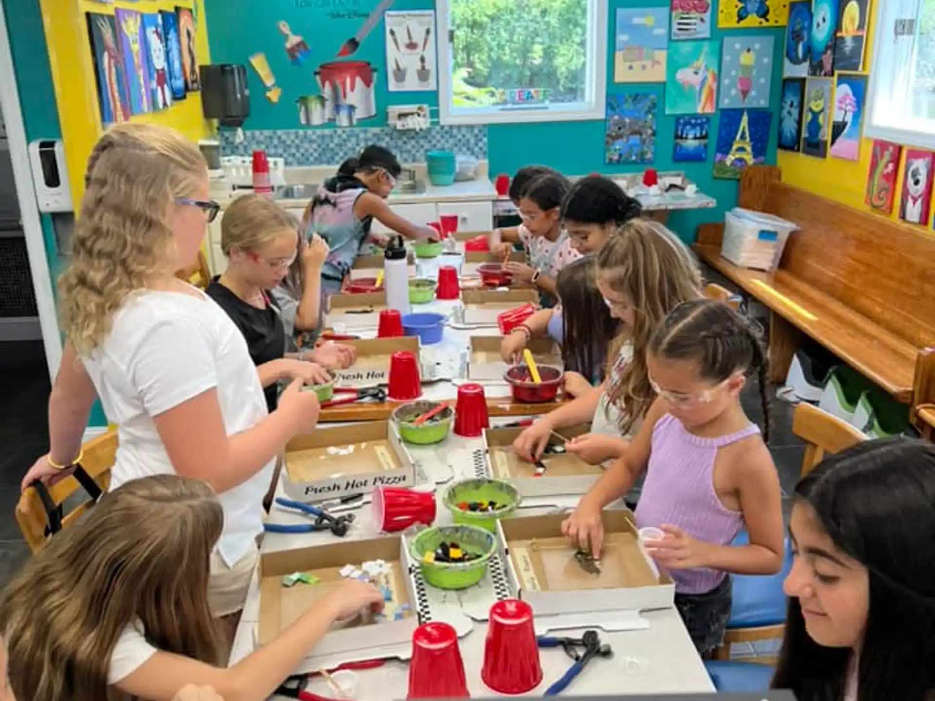 a group of children sitting at a table