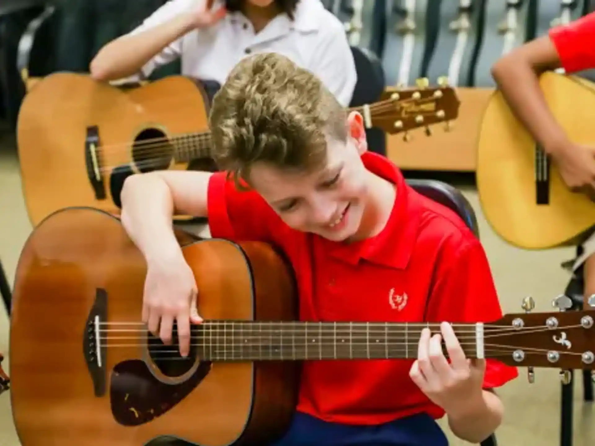 a boy playing a guitar