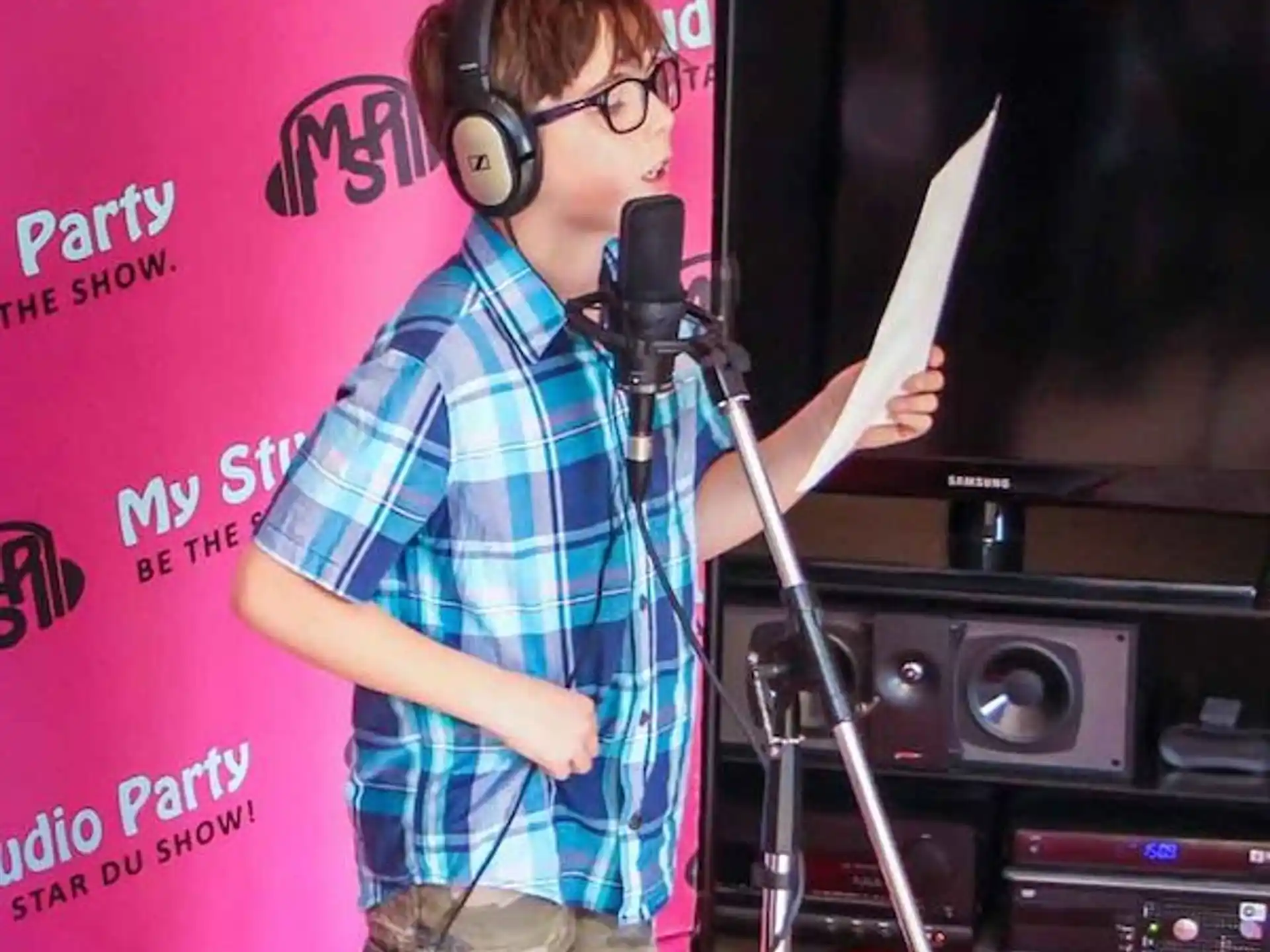 a person wearing headphones and holding a microphone