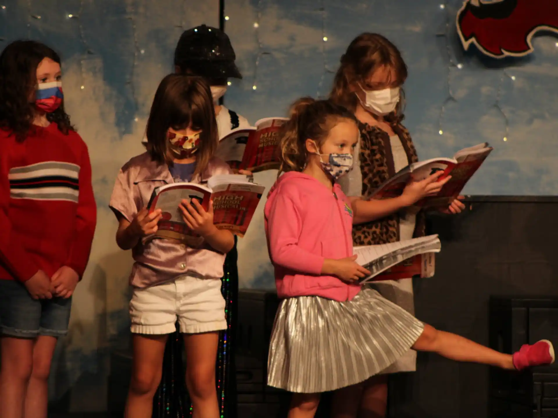 a group of girls wearing face masks