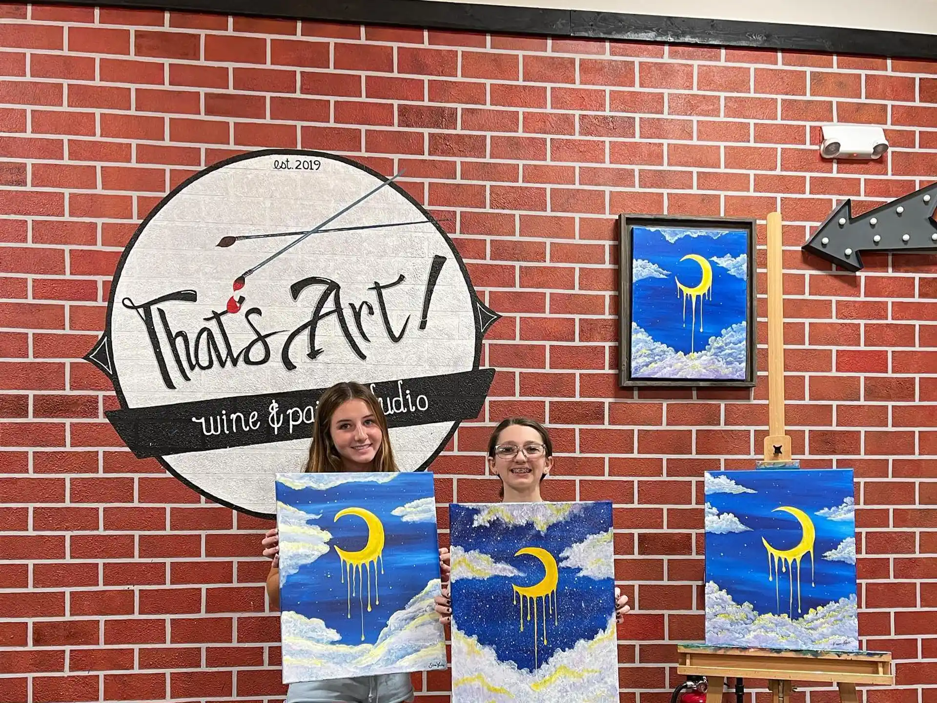 a couple of people holding posters