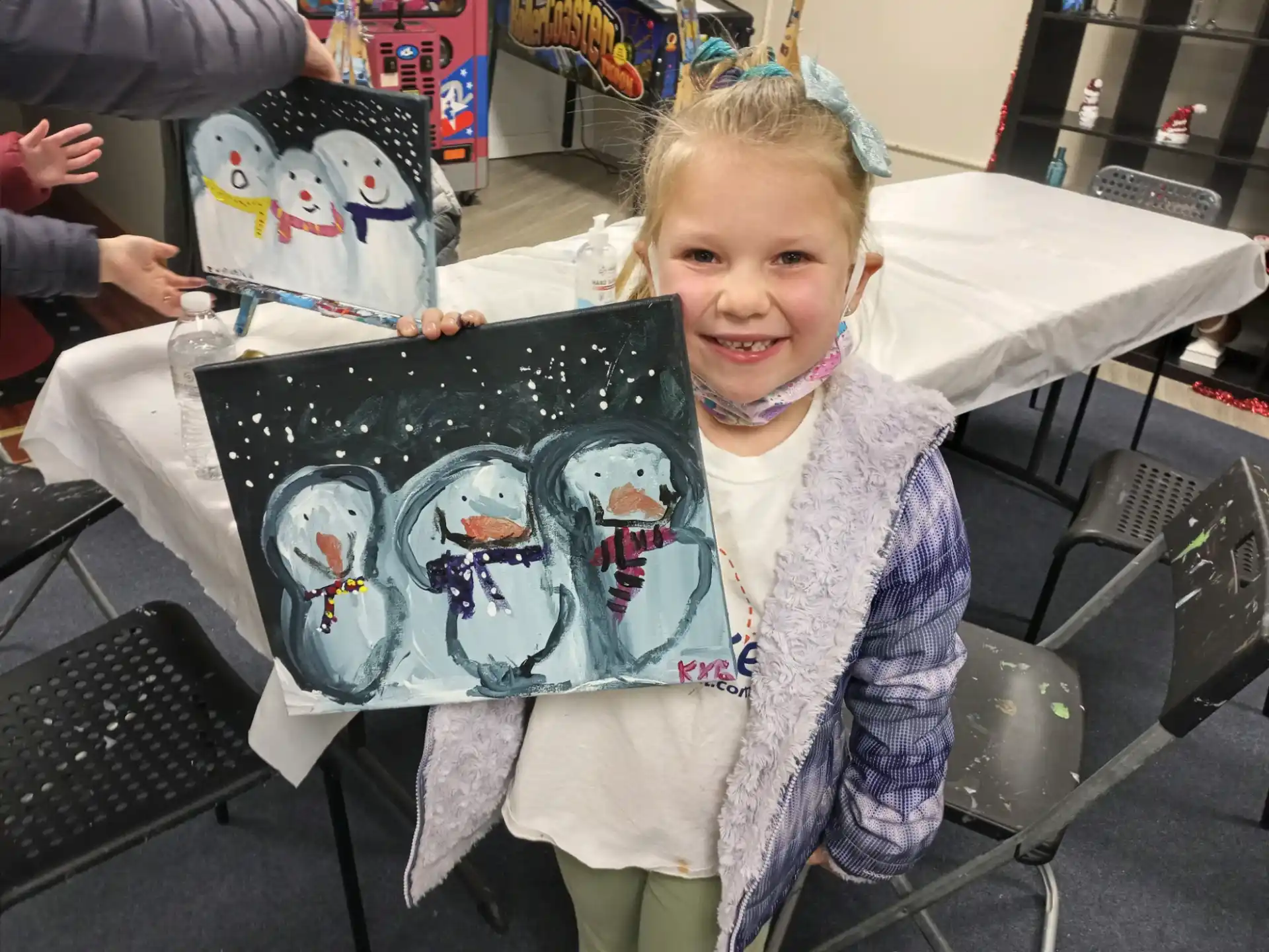 a girl holding a cake
