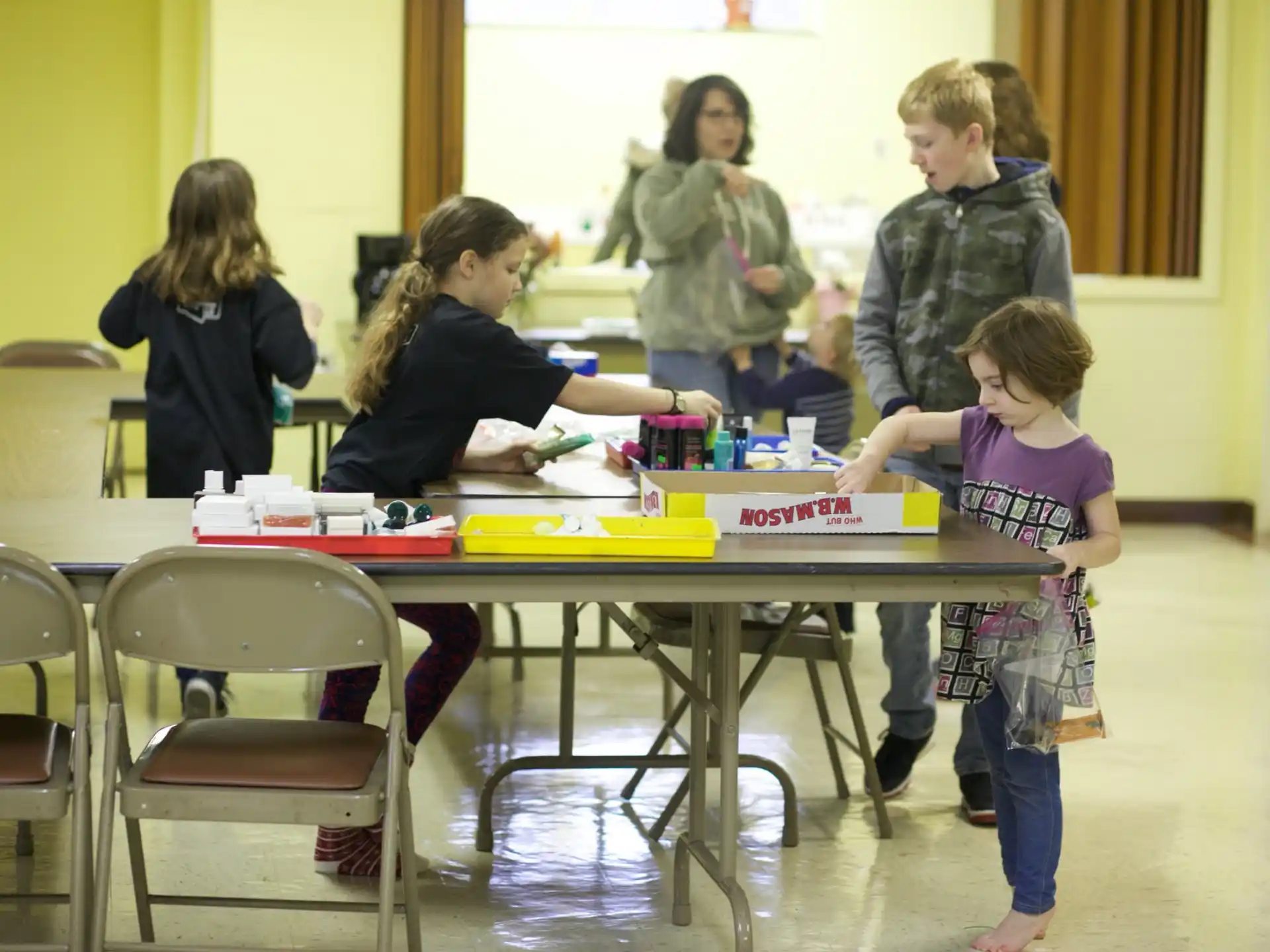 a group of children around a table