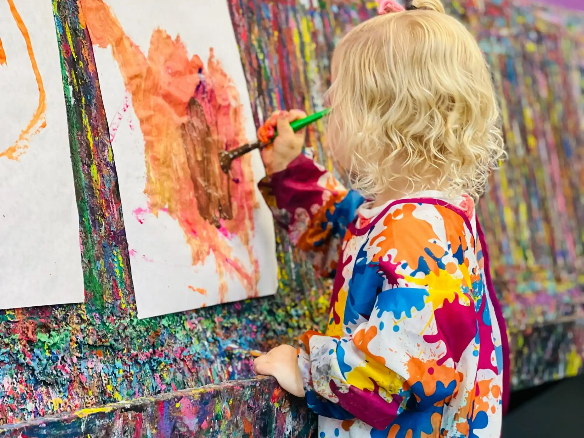 a child painting on a wall
