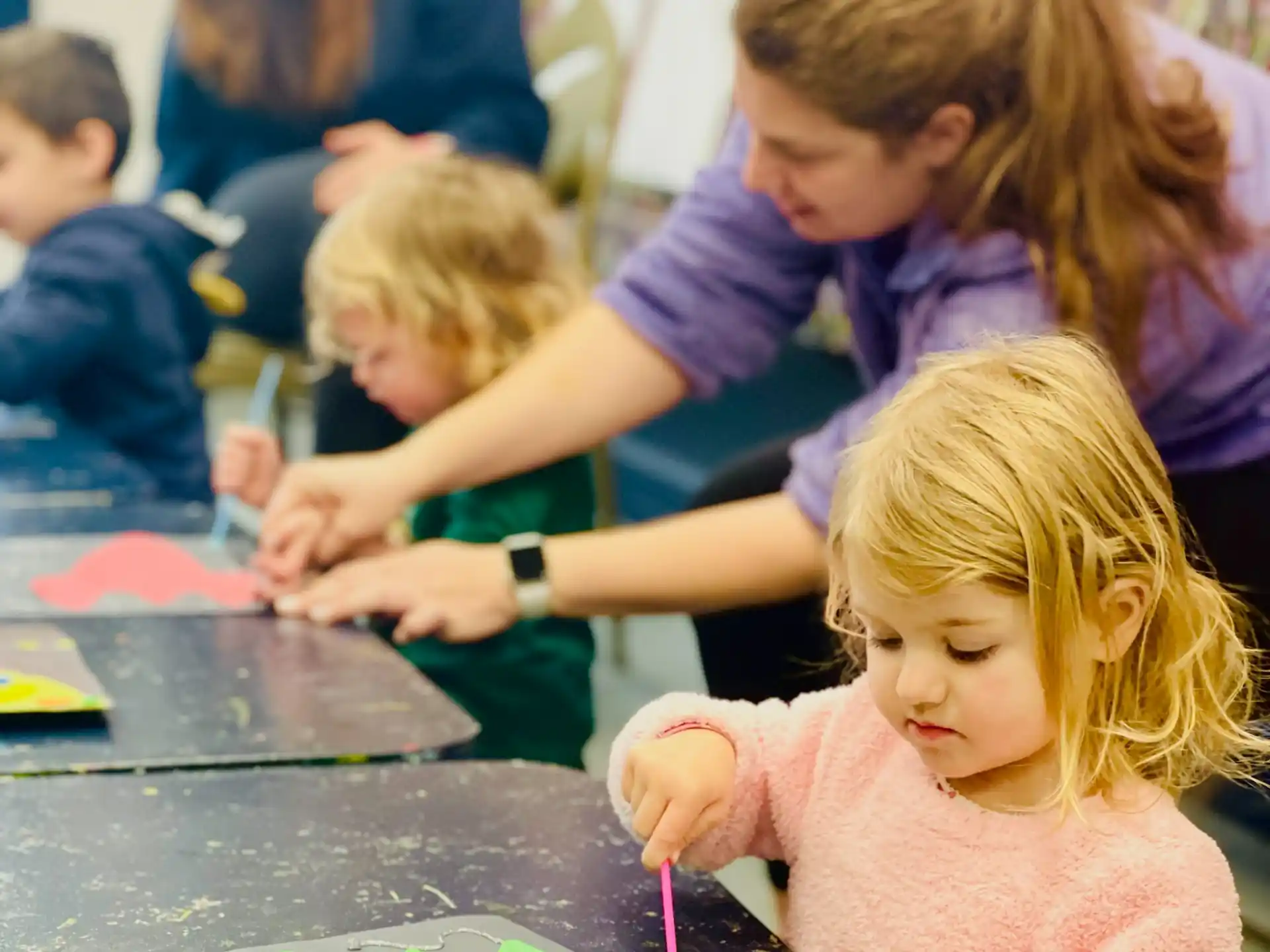 a group of children painting
