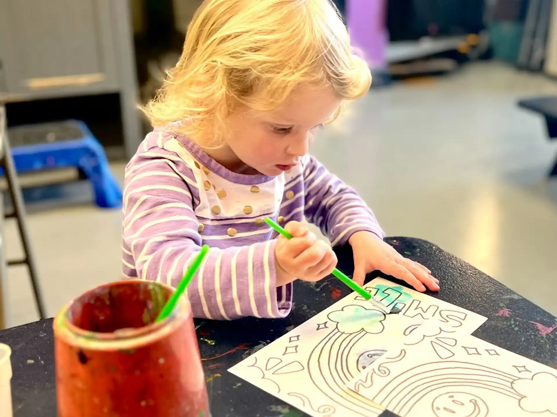 a young girl painting