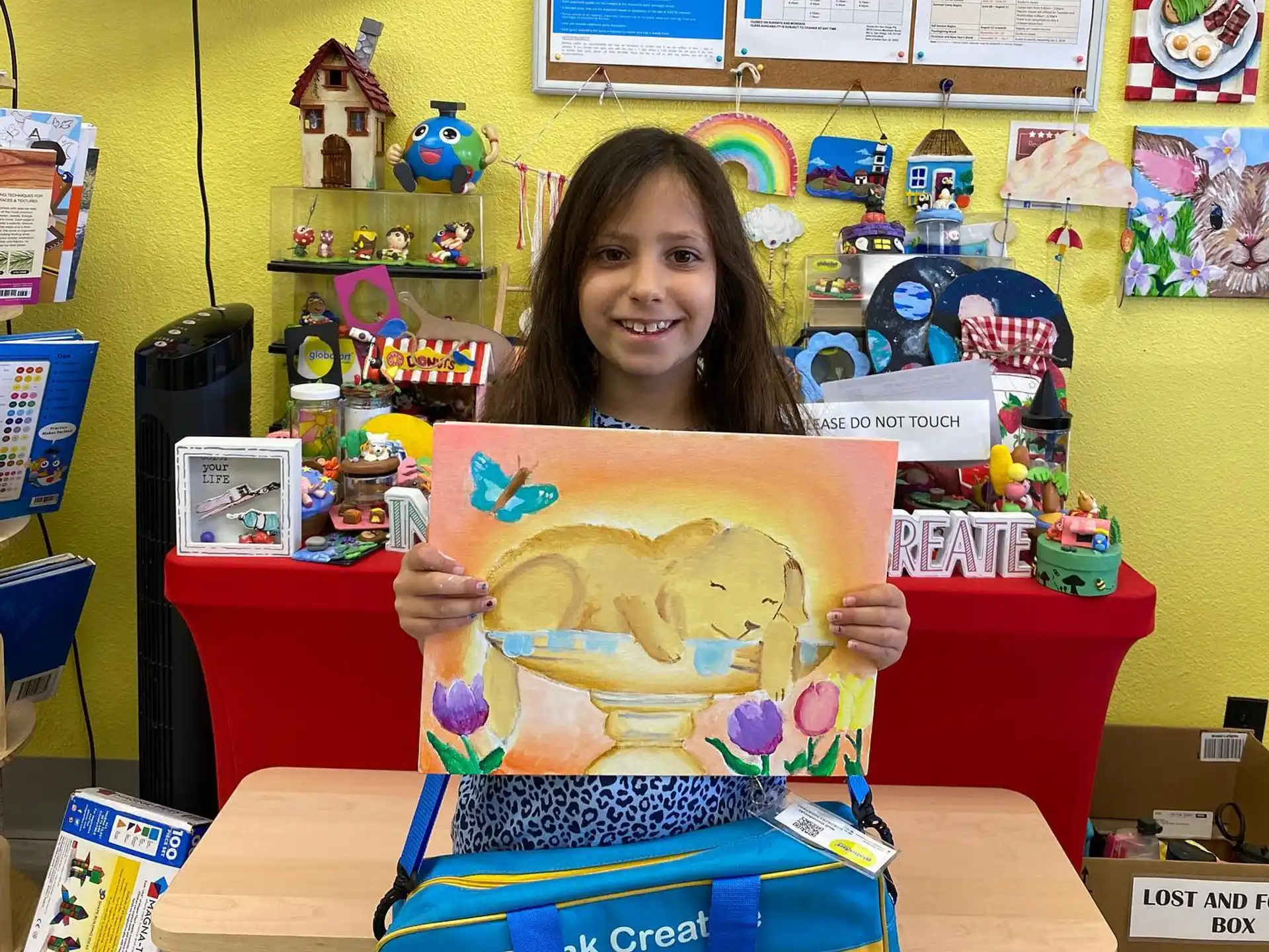 a girl holding a cake