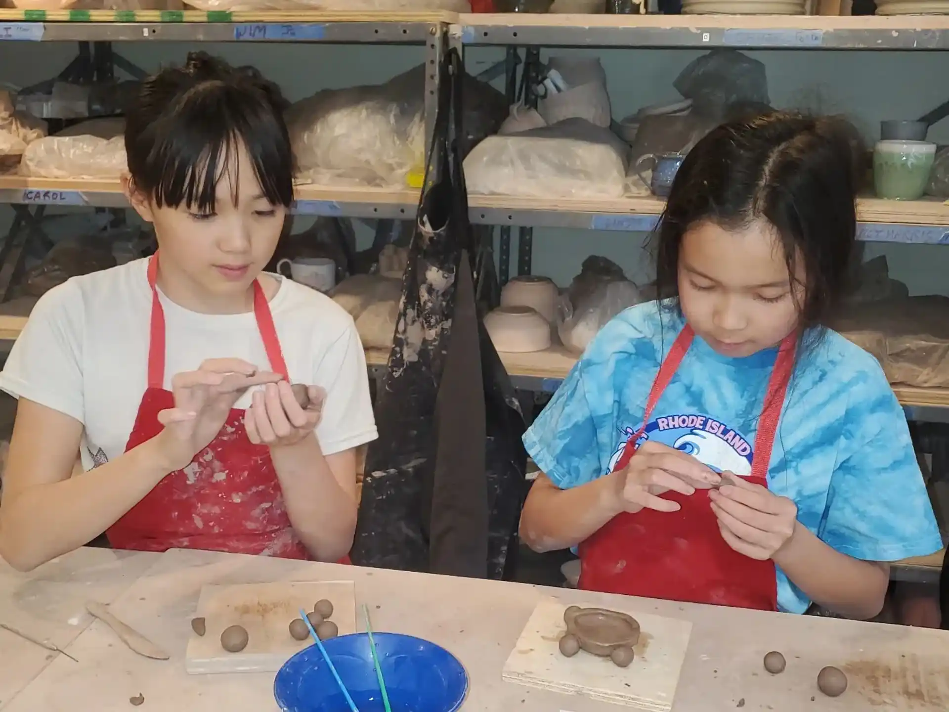 a couple of young girls painting