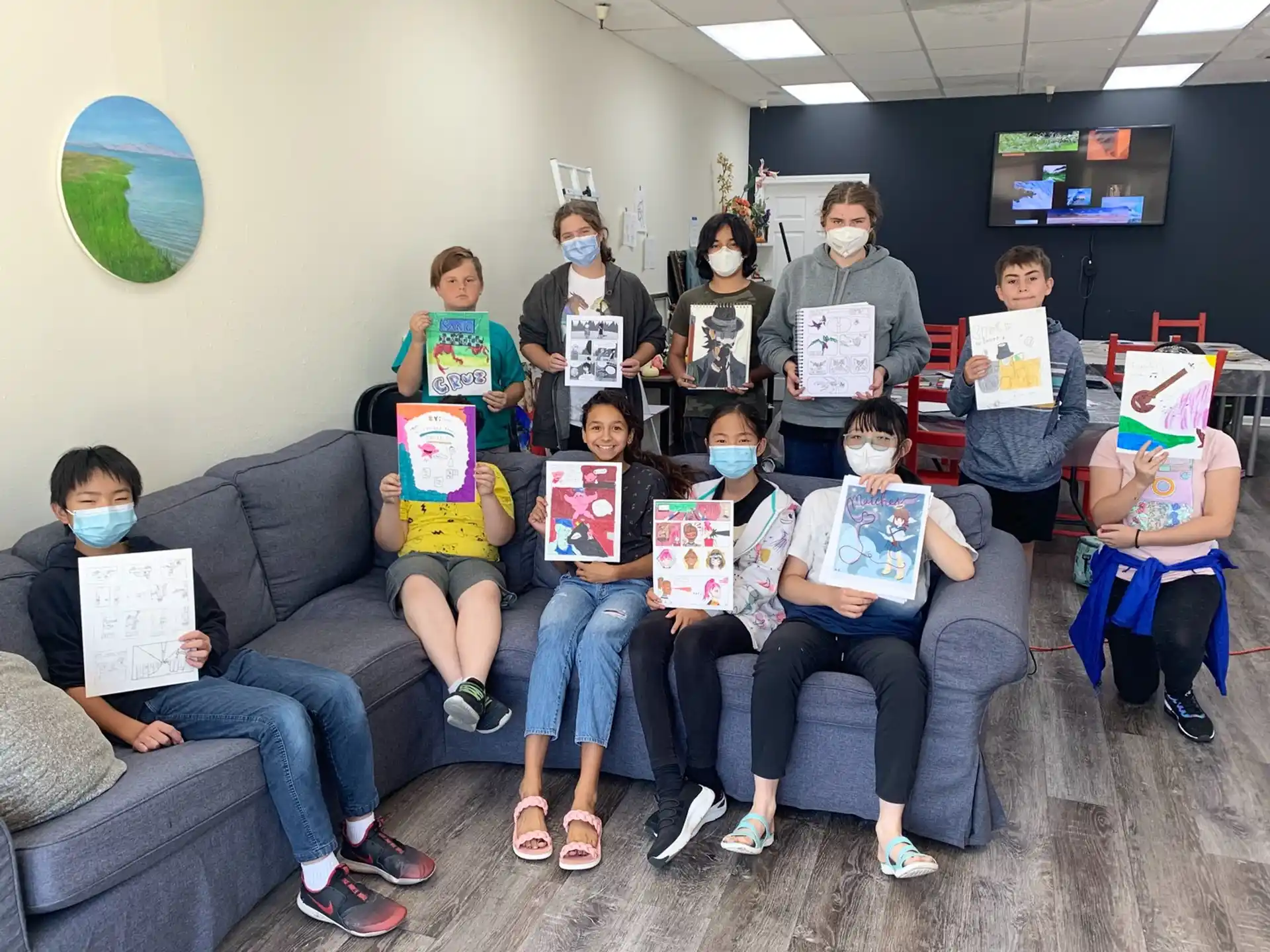 a group of people holding up books