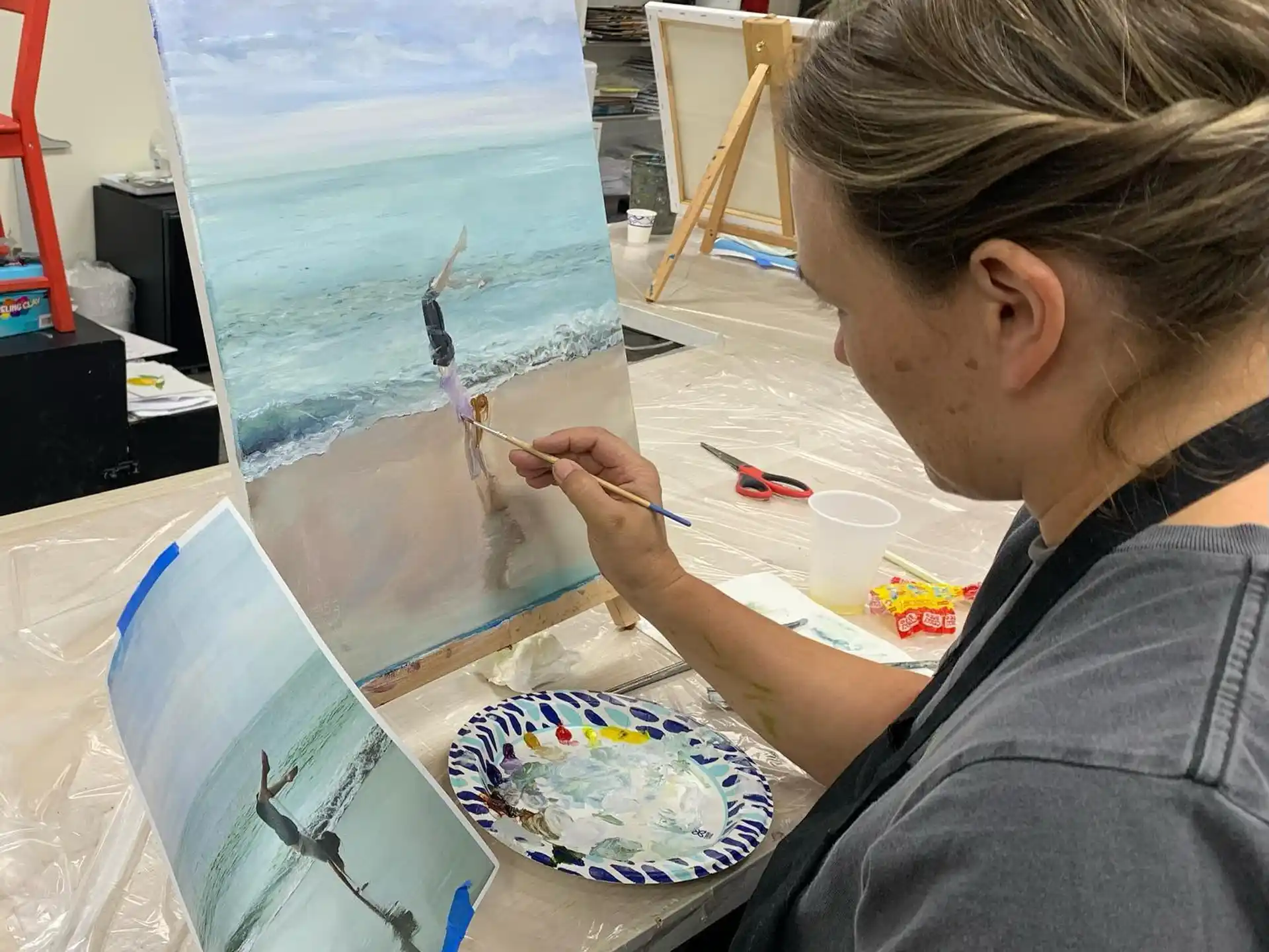 a person painting on a table