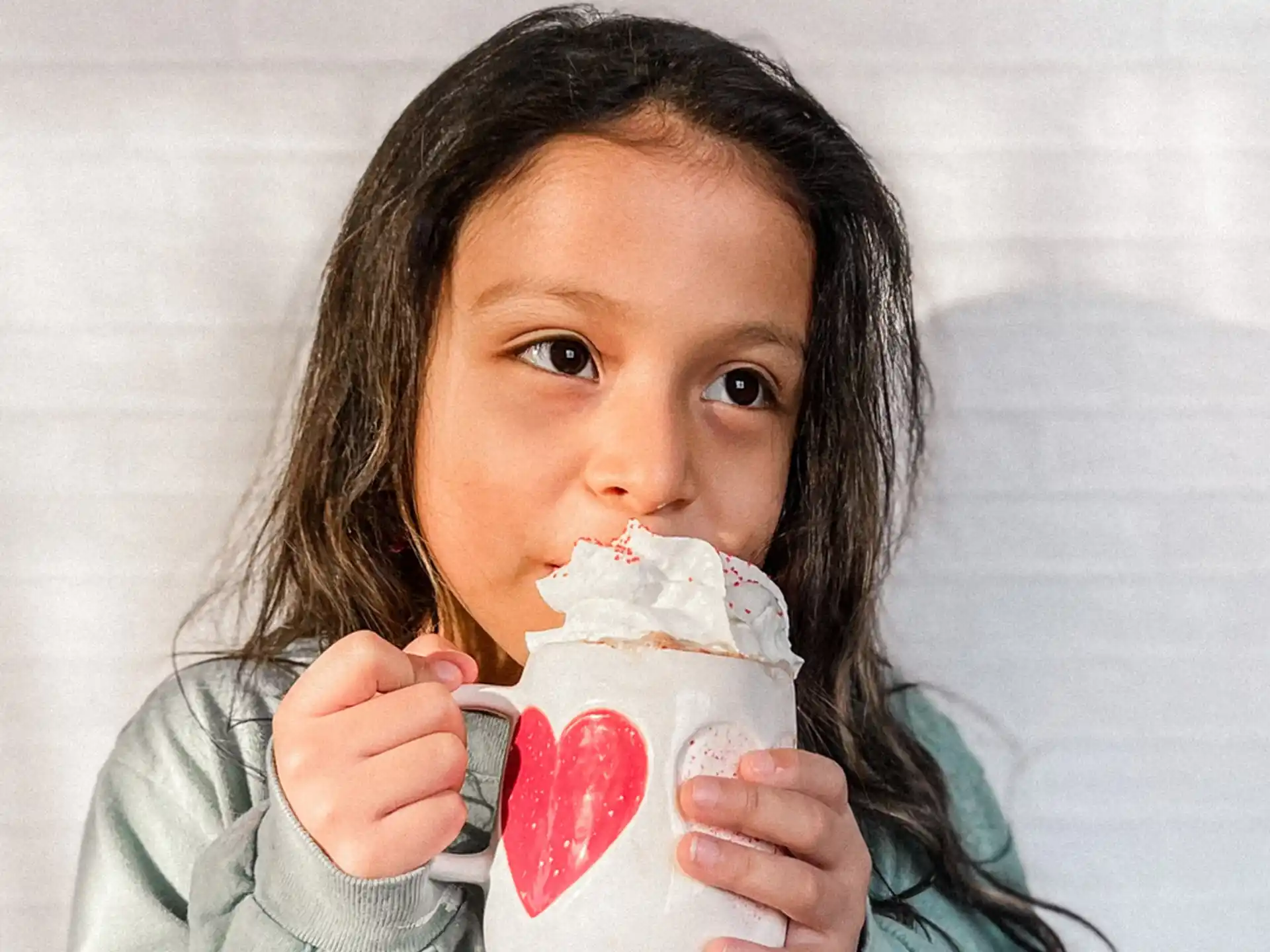 a girl eating a cupcake