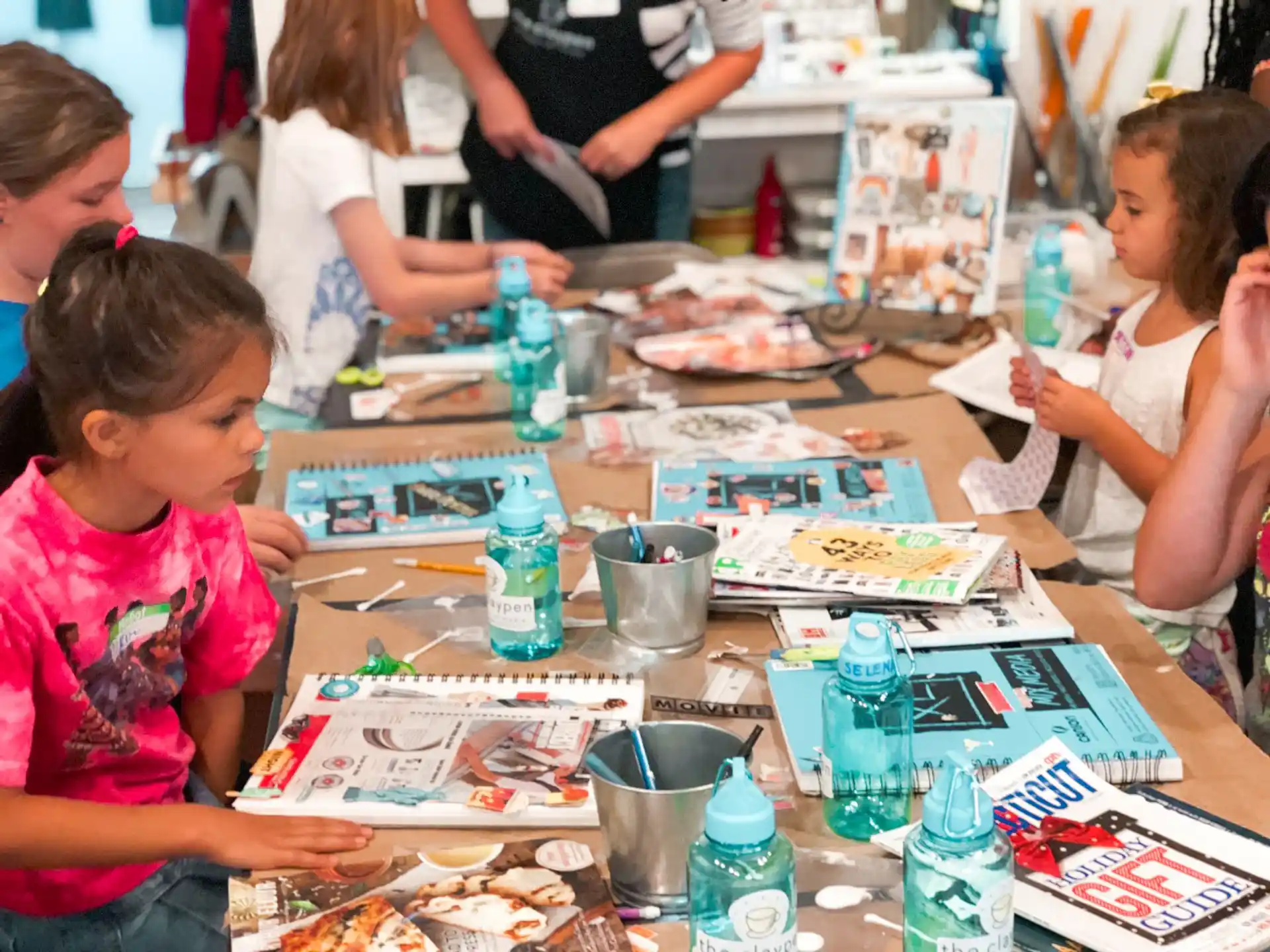 a group of children painting