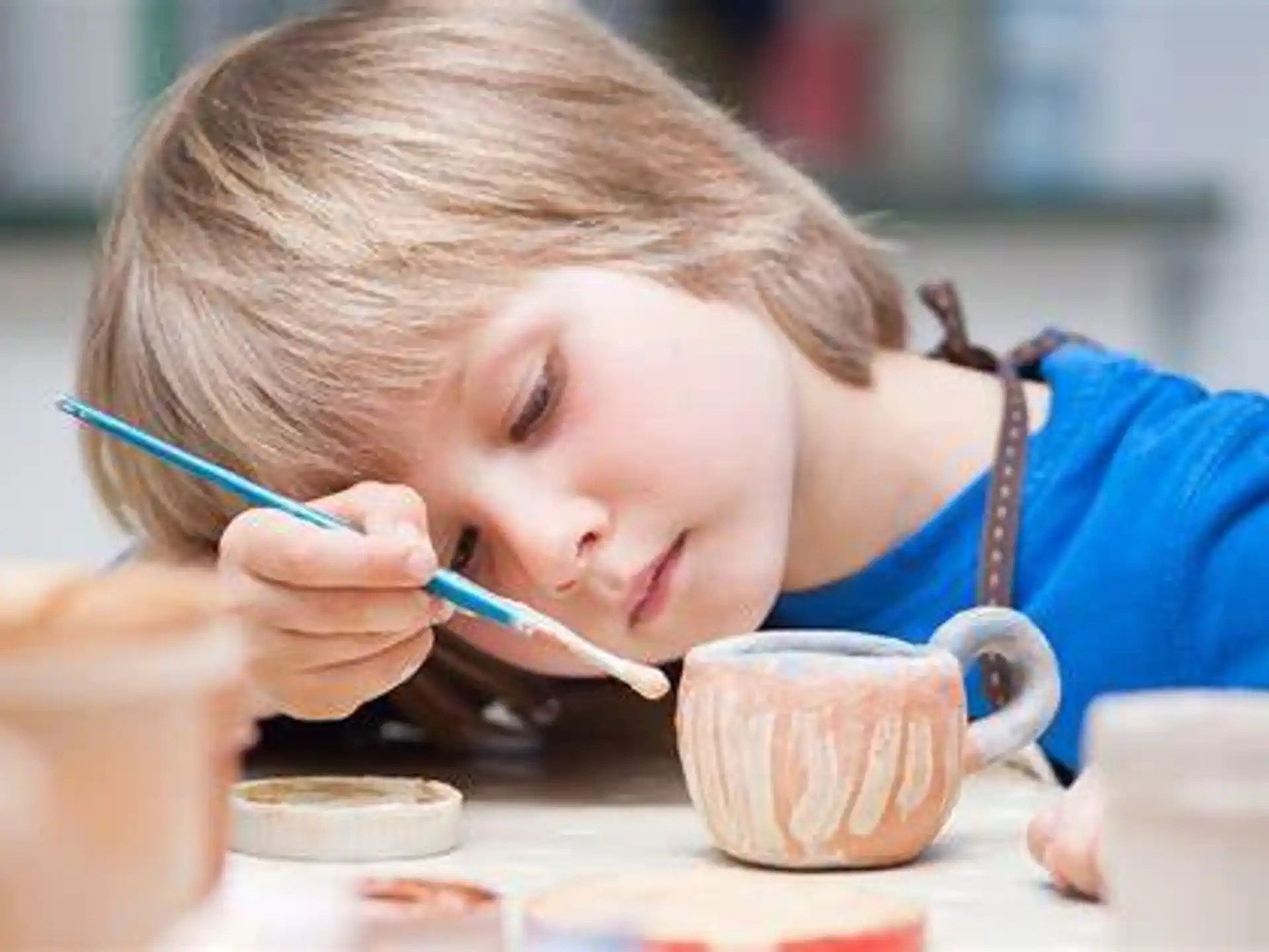 a young girl painting