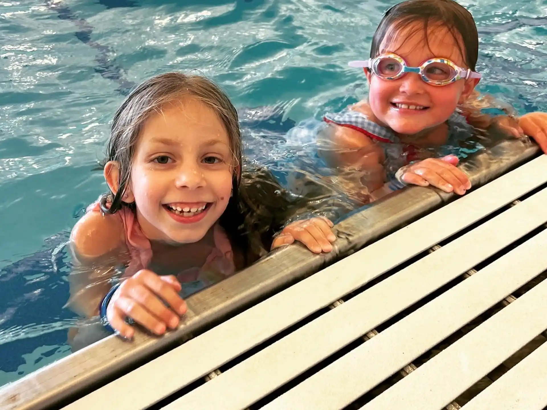 a couple of children in a pool