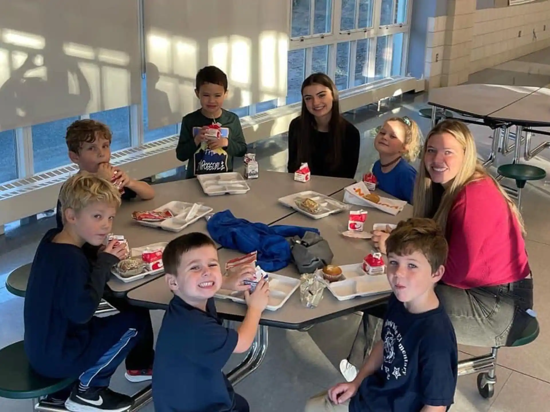 a group of people sitting around a table