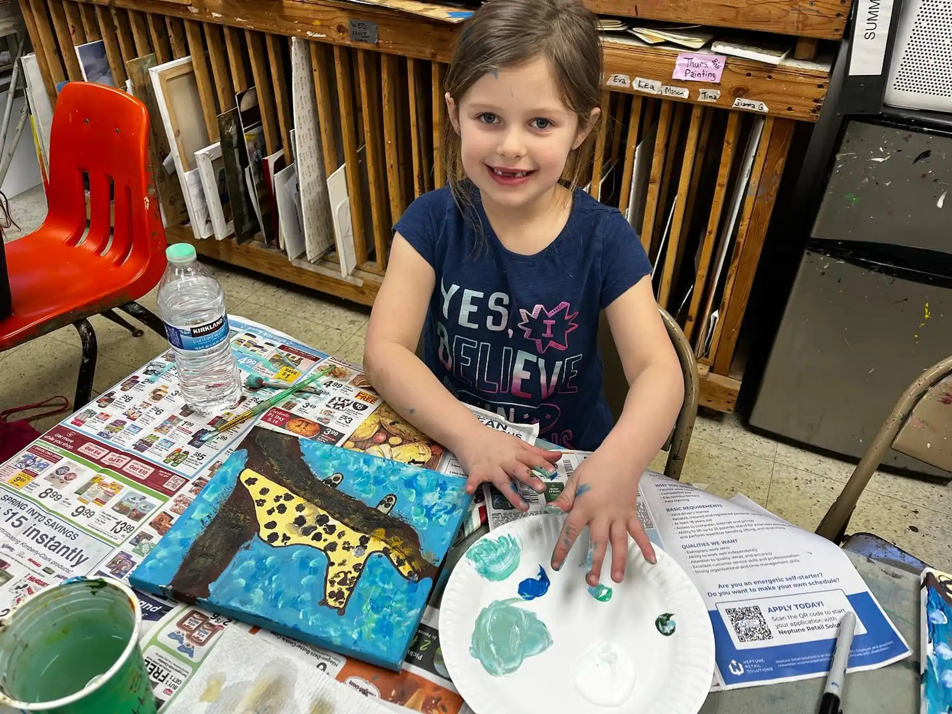 a young girl painting