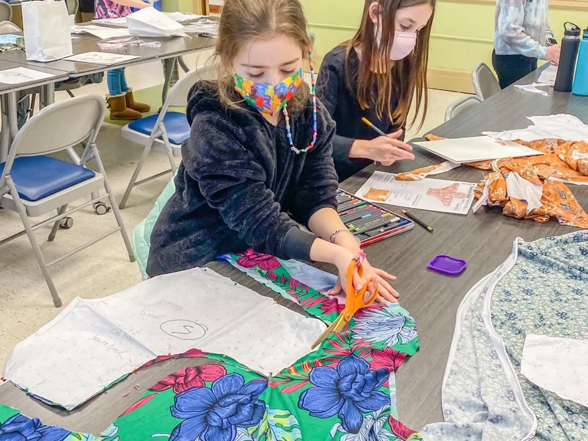 a group of children painting