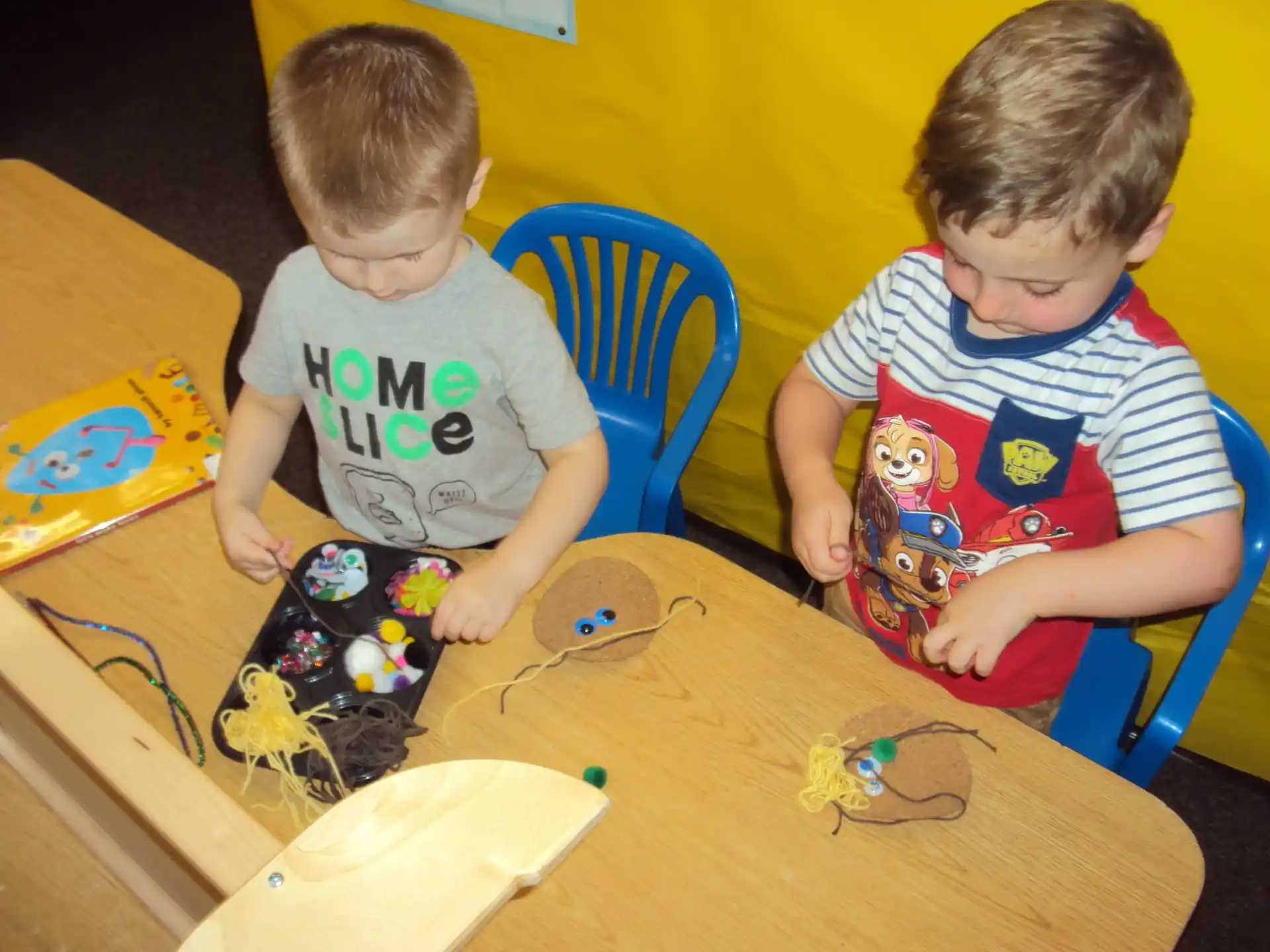two boys playing with toys