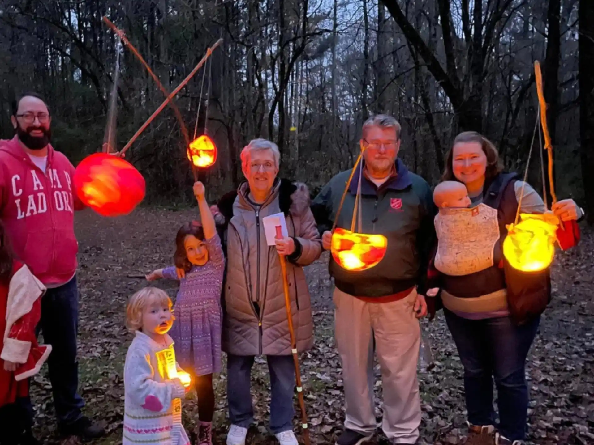 a group of people holding balloons