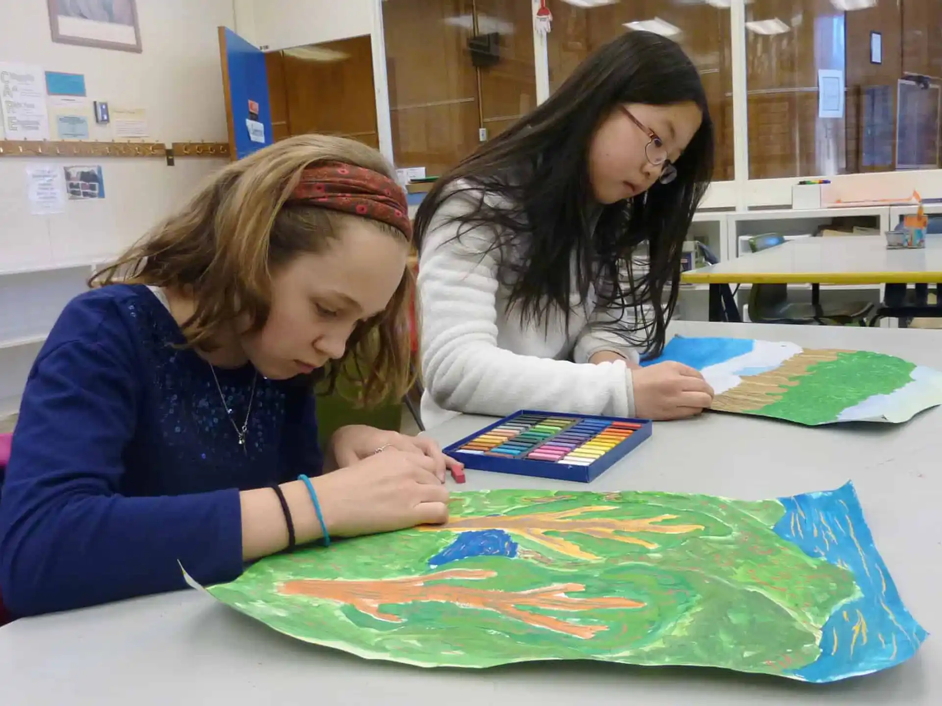 a few young girls painting