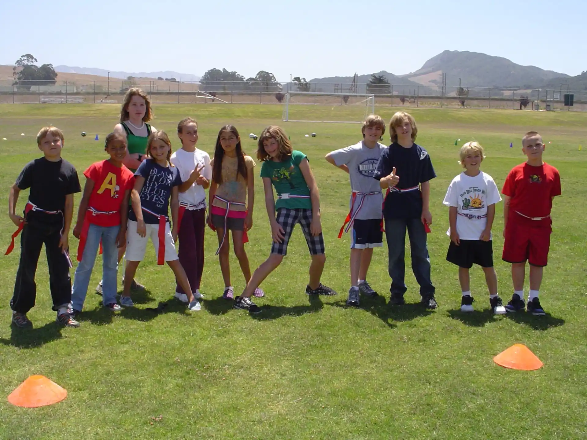 a group of people standing on a field