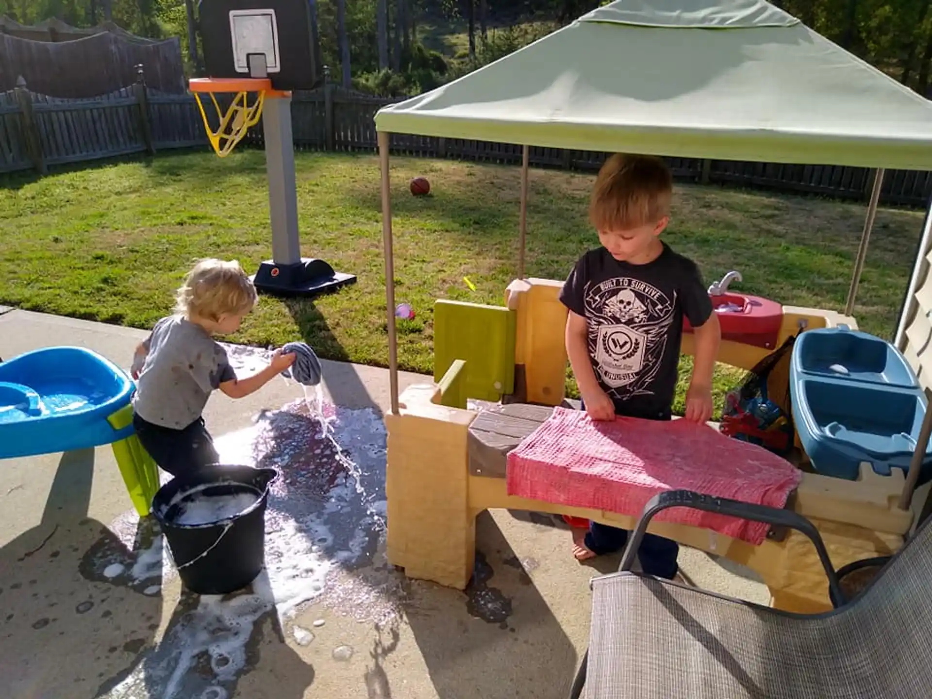 a couple of kids playing in a play area